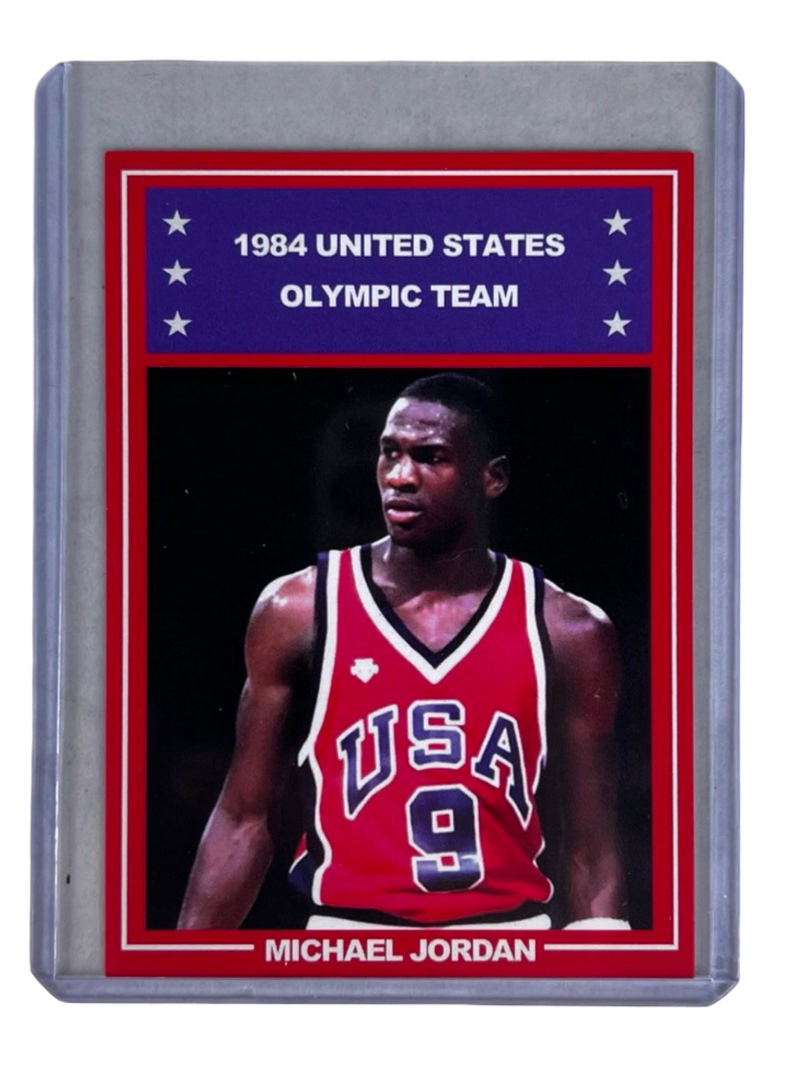 Michael Jordan 1984 USA Olympic Team Rookie Card: Michael Jordan 1984 United States Olympic Team rookie basketball card featuring the legendary Chicago Bulls superstar in his iconic USA uniform. This red border edition showcases Jordan during the 198