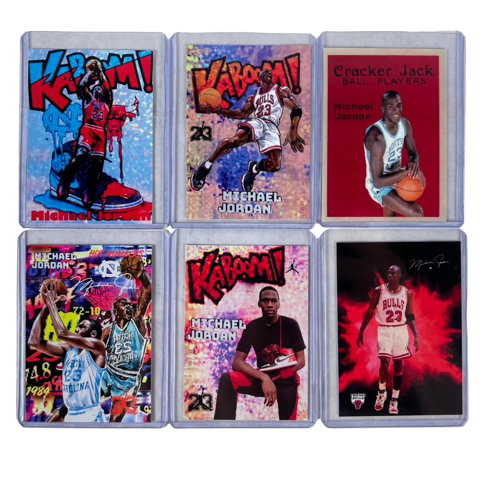 Michael Jordan Bulls Basketball Card Collection: Collection of 6 Michael Jordan basketball cards featuring the Chicago Bulls legend in a variety of colorful modern and tribute-style card designs. Includes "Kaboom!" themed cards, collegiate North Car