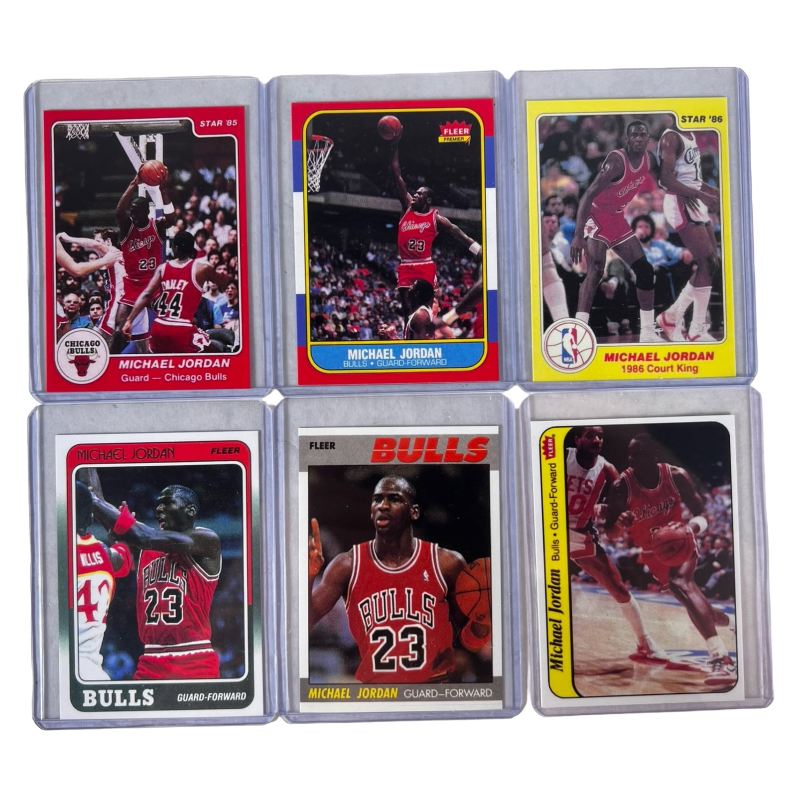 Michael Jordan Reprint Basketball Cards - Rookie: Collection of 6 Michael Jordan reprint basketball cards featuring the legendary Chicago Bulls superstar, including a reprint of his iconic rookie-era card along with classic Fleer and Star Company