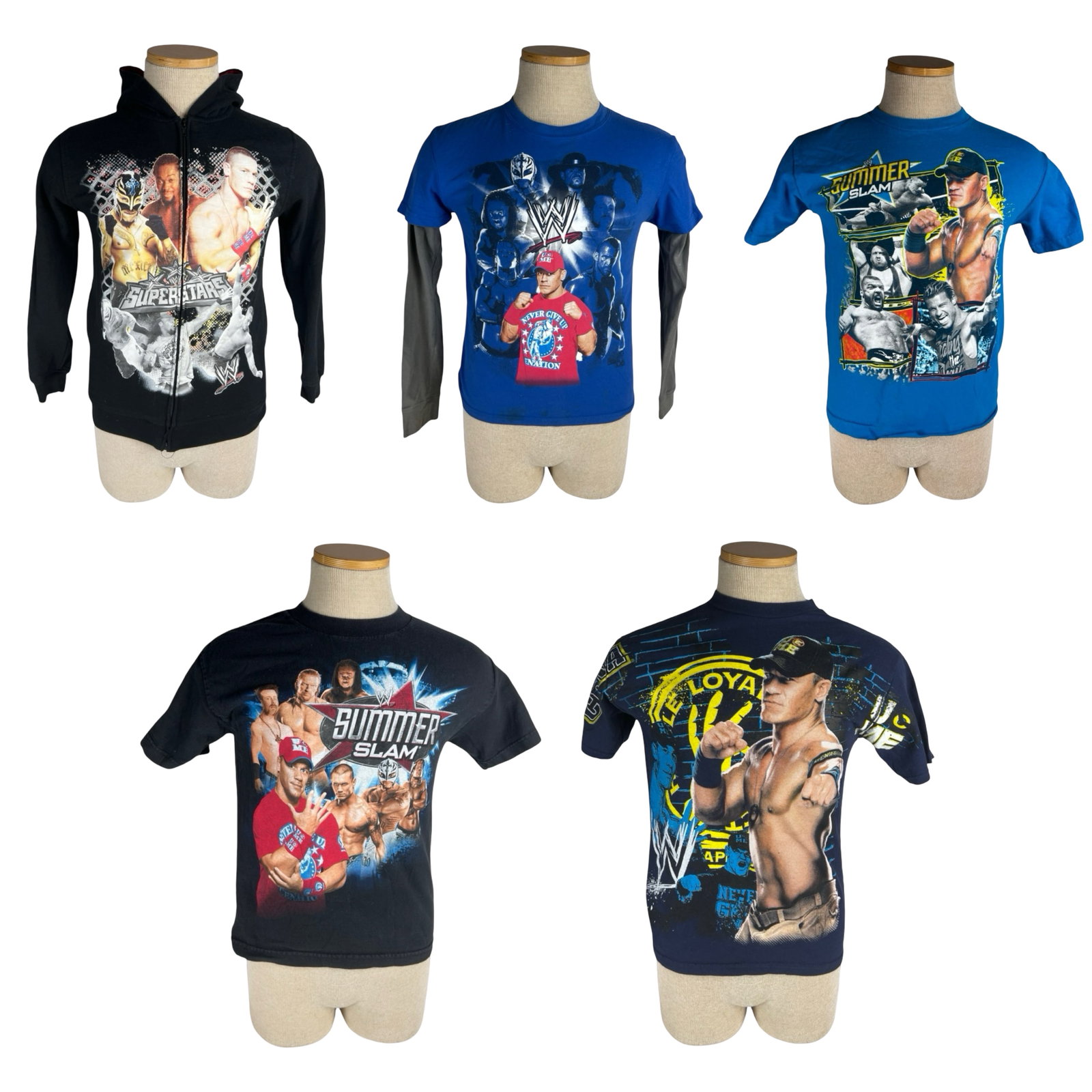Vintage WWE Cena, Mysterio & SummerSlam T-Shirts: Group of five vintage WWE graphic apparel pieces including John Cena, Rey Mysterio, The Undertaker, Triple H, Sheamus, and SummerSlam themed designs. Includes four graphic T-shirts and one zip-front W