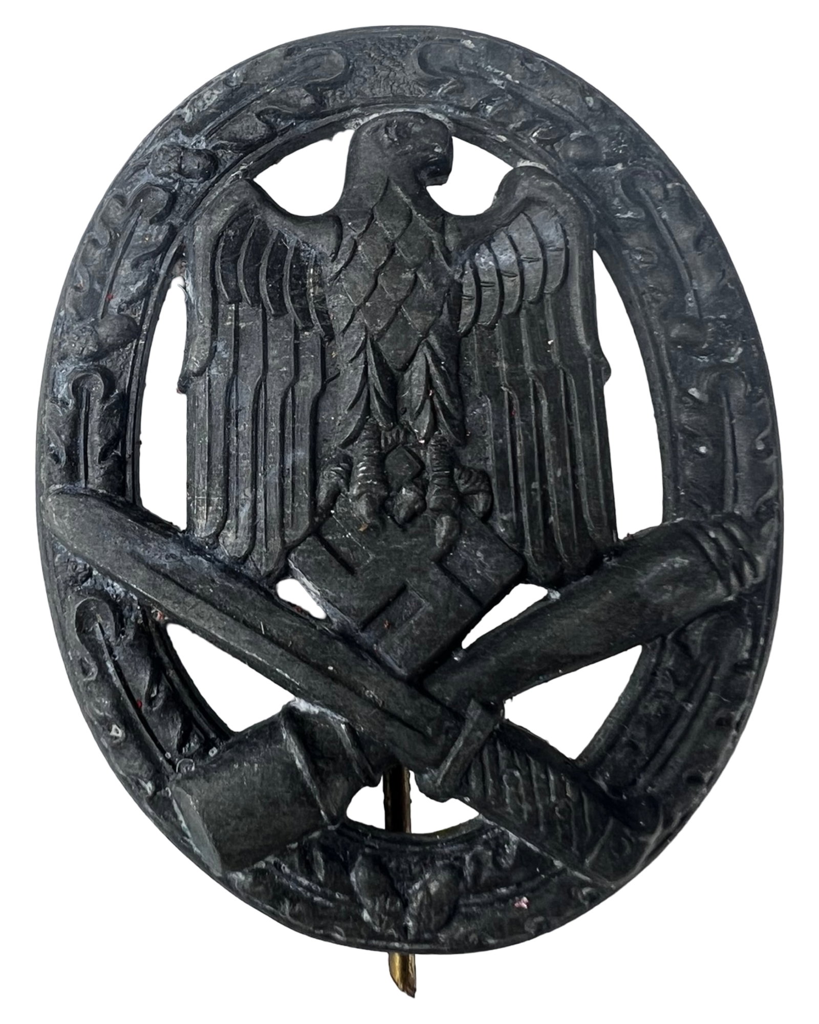 WWII German General Assault Badge: WWII-era German General Assault Badge featuring an eagle above crossed weaponry within an oval wreath. The reverse shows a vertical pin-back construction with hinge and catch intact, along with a visi