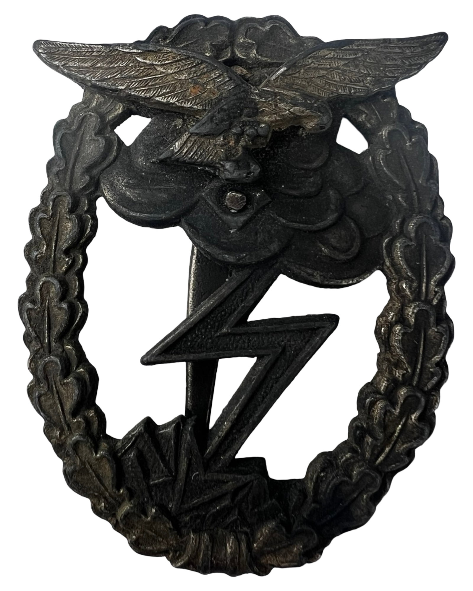 WWII German Luftwaffe Ground Assault Badge: WWII German Luftwaffe Ground Assault Badge featuring the characteristic wreath, central vertical sword, and lightning bolt motif beneath a Luftwaffe eagle. This example retains strong detail throughou