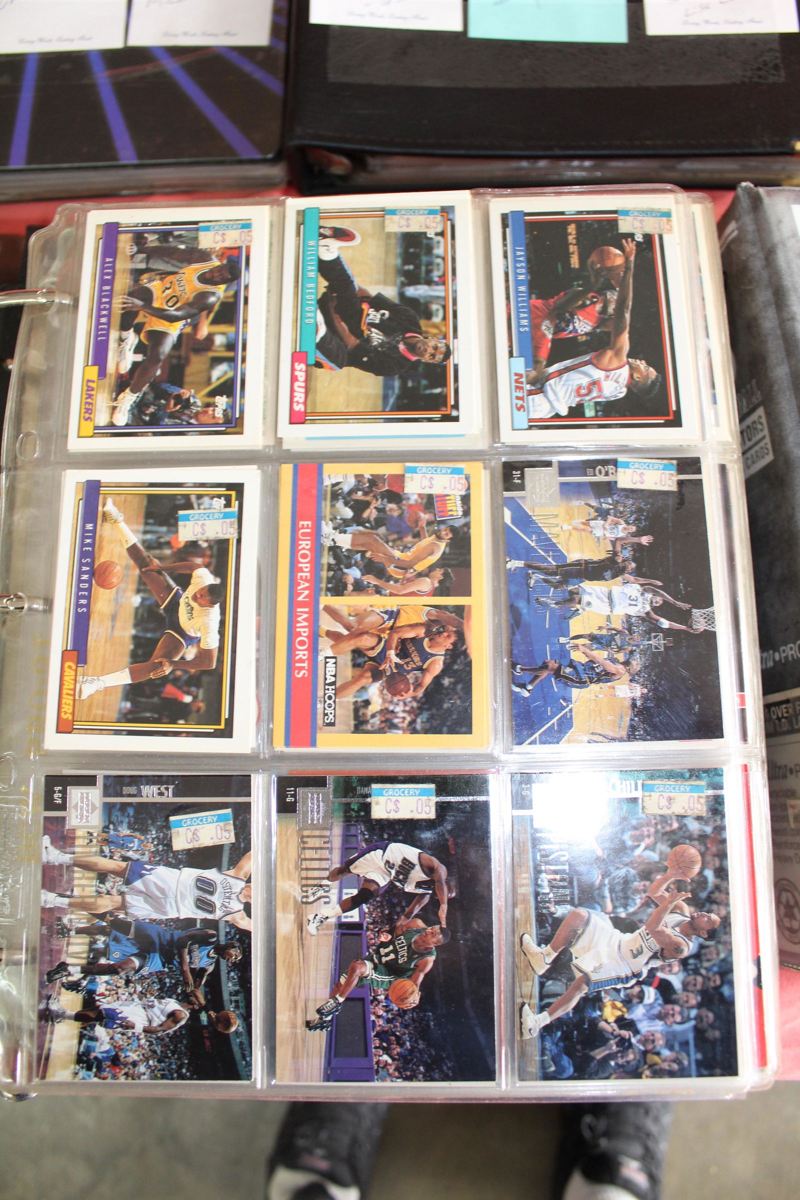 Album of misc 1990s basketball cards: Karl Malone, Charles Barkley, Larry Bird, Larry Johnson, Clyde Drexler, Dominique Wilkins, Isaiah Thomas, John Stockton, and more
