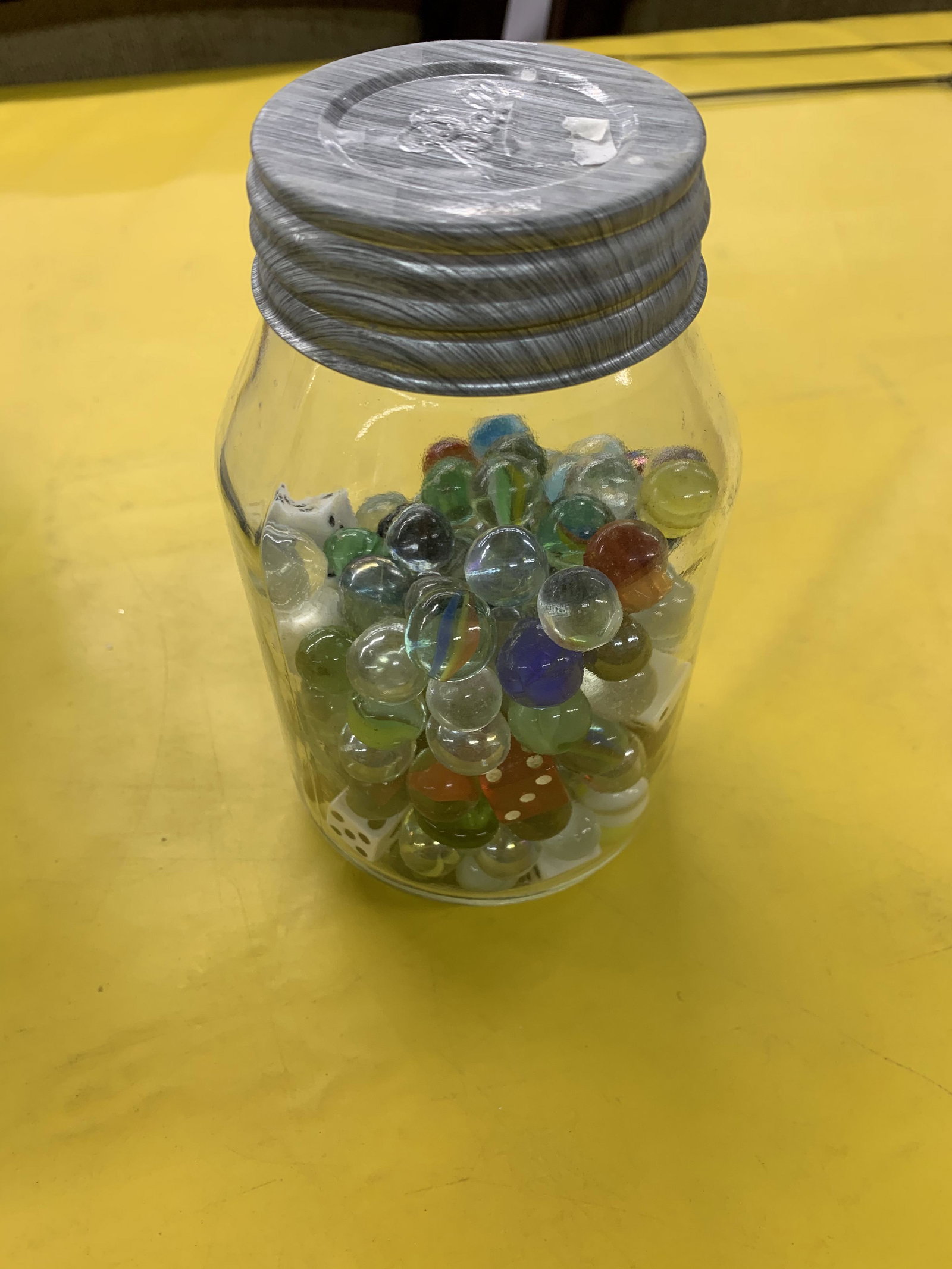 Jar of assorted marbles & dice with milk glass zinc lid: Jar of assorted marbles & dice with milk glass zinc lid