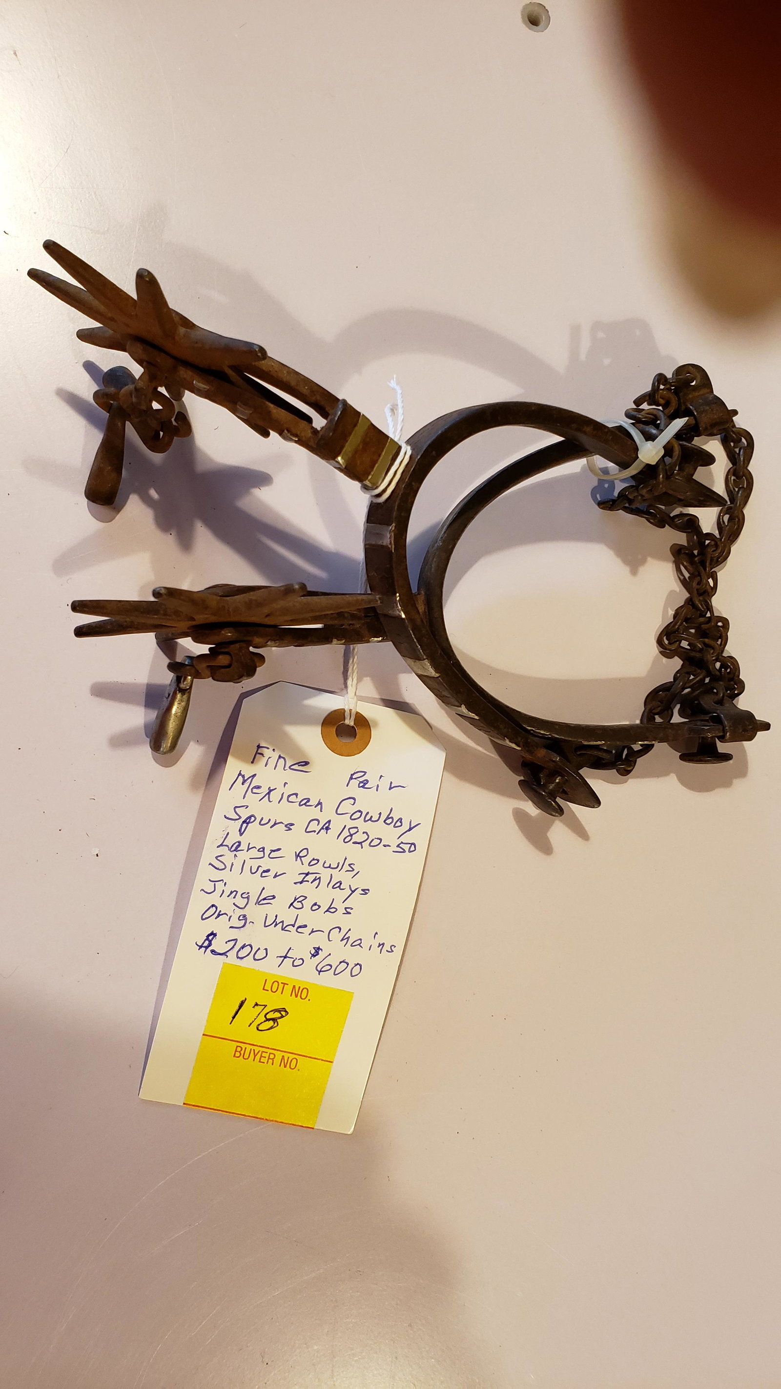 Mexican cowboy spurs: Fine pair Mexican cowboy spurs ca. 1820-1850, large rowls, silver inlays, jingle bobs, original under chains