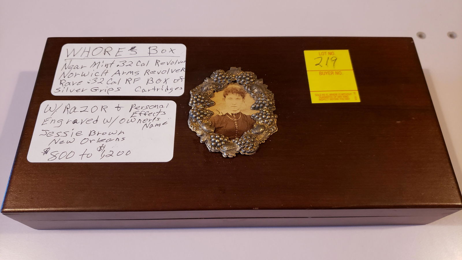 Cased Norwich Arms .32 cal revolver: Whoreâ€™s box, Cased Norwich Arms .32 cal revolver, near mint, rare .32 cal. RF, box of Silver Grips cartridges, w/razor & personal effects, engraved w/ownerâ€™s name Jessie Brown, New Orlea