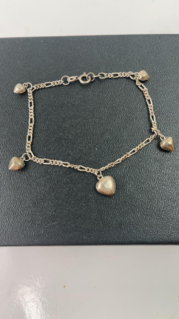 Vintage 925 Silver Heart Bracelet: Vintage 925 Silver Heart woman's Bracelet. Chain bracelet with small hearts hanging from it. About 7.5" L 5.24G