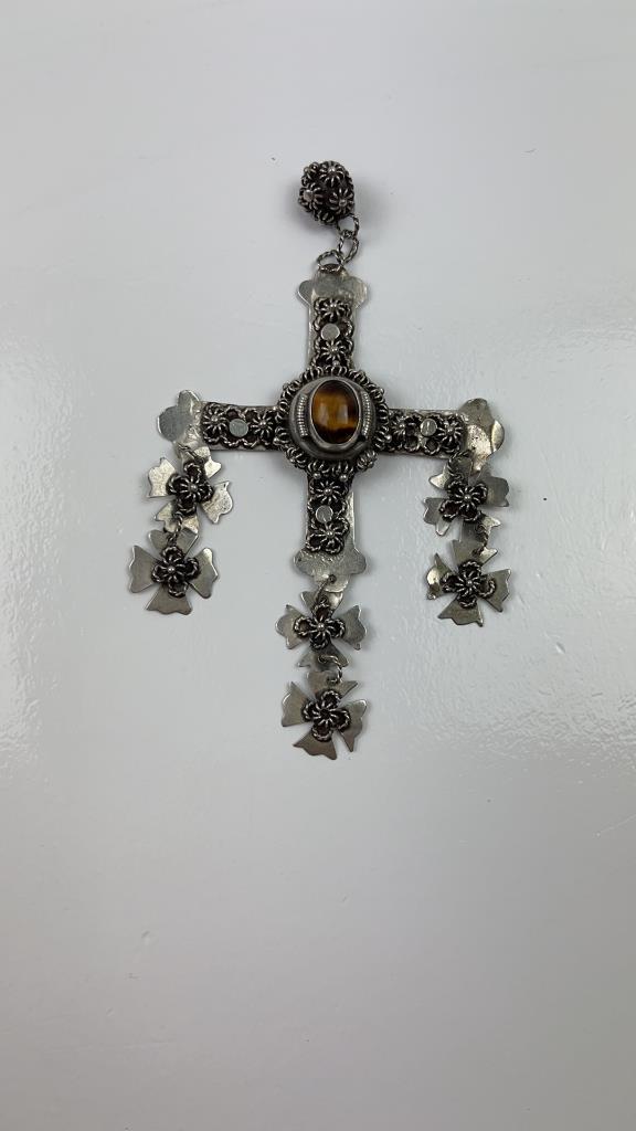 Sterling Silver Tigers Eye Taxco Cross Pendent: Vintage Sterling Silver Tigers Eye Taxco Cross pendent stamped on the back. Great detail and one of a kind. Tigers eye in the middle has beautiful color. Good overall condition and weight. About 4"L x
