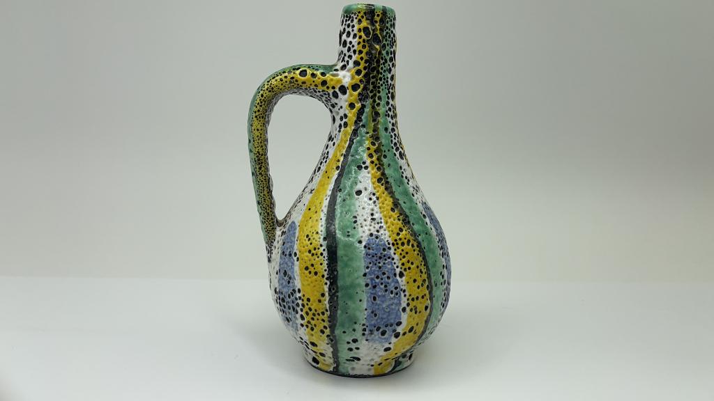 Signed Made in Germany Clay Vase Pitcher: Signed and Numbered Made in Germany Clay Panted and Enamled Gourd Vase with Handle. Good Overall condition. Very pretty colors with pitting texture. Measures about 7"l x 4"w $15.00 US Shipping