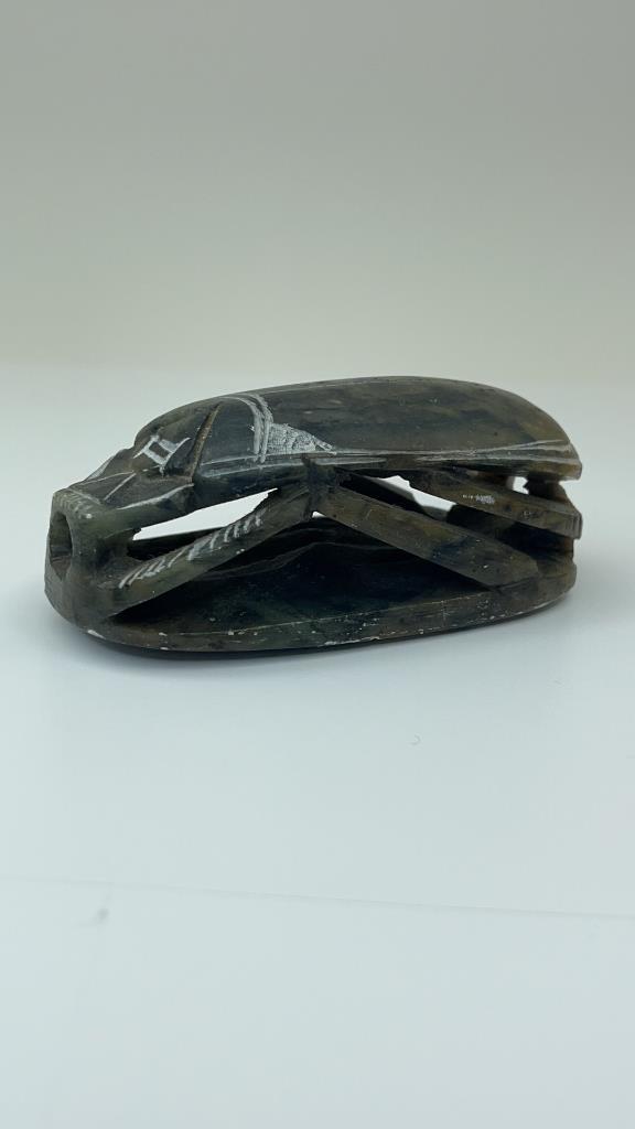 Vintage Carved Egyptian Soapstone Scarab Beetle: Vintage Egyptian Hand Carved Stone Scarab Beetle with Hieroglyphics carved on the bottom of the Paper Weight. Good Overall condition Measures about 5"l x 2.5"w $15.00 US shipping