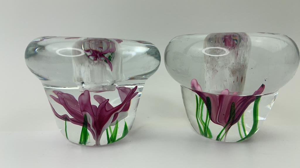 DYNASTY GALLERY ART GLASS PAPERWEIGHT CANDLE HOLDF: Pair of Dynasty Art gallery paperweight candle holder. Very pretty Pink and green flower design on the bottom. Good OVerall condition. Stickers still on the bottom. Good weight and size. Measures abou