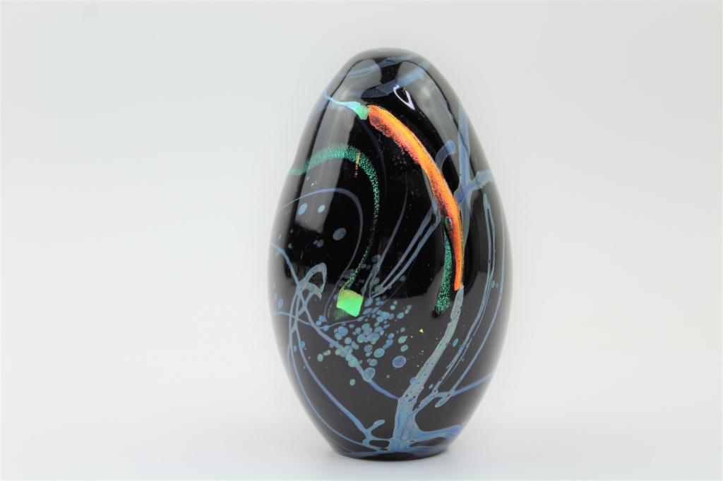 Handcrafted Crystal Art Glass Egg Paperweight: Beautiful Black Crystal hand crafted Egg Paperweight with beautiful Blue Gree and Orange Glitter Swirls. Good Overall Condition and weight. Measures about 5.5"T x 2"W $15.00 US Shipping
