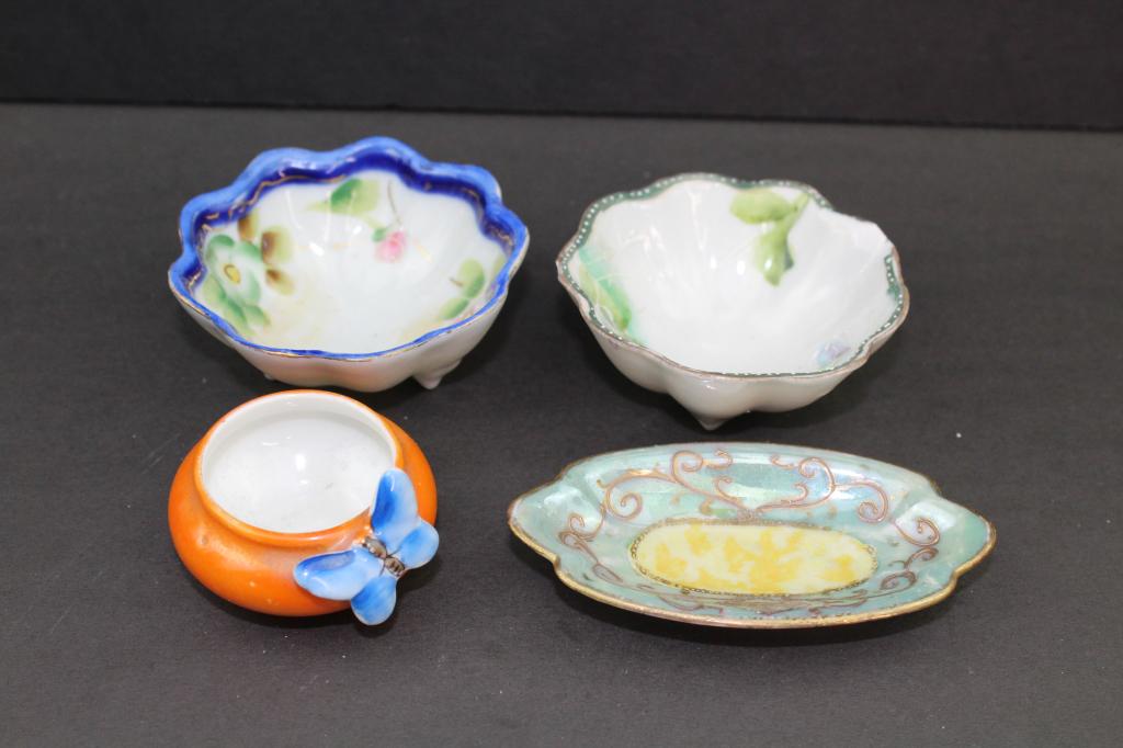 Lot Of 4 Hand Painted Porcelain Salt Cellars: Lot of 4 Hand Painted Porcelain Salt Cellars. 2 are marked made in japan. Larger Footed Ones measures about 2 3/4"w x 1.5"t . Oval shapped one measures about 3.5"l and the small orange bowl with butte