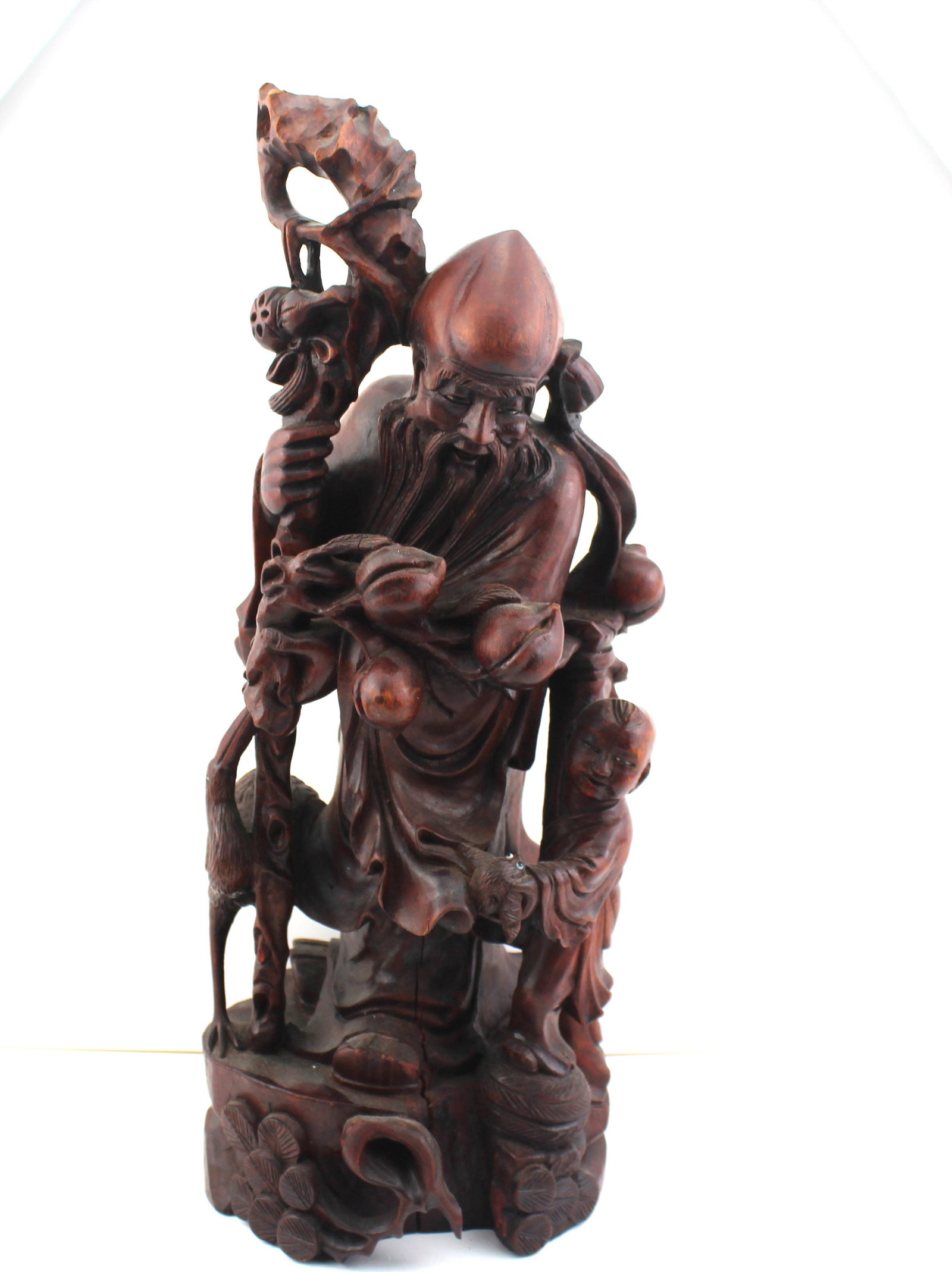 Antique Red Hardwood Chinese Scholar With young Boy: Large Antique Chinese Red Hardwood Hand Carved Scholar with a young boy at his side. Boy is holding an animal in his hands and the scholar has Fruit in his hands with a stork crane at his side. Good O