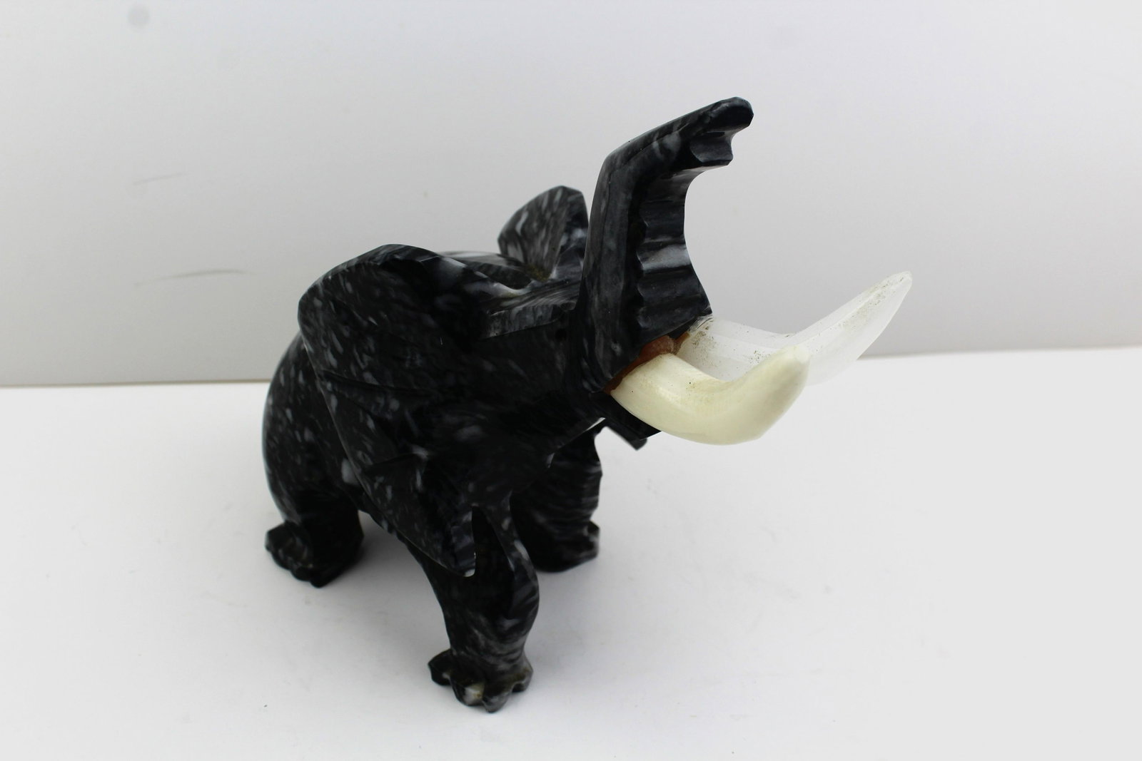 Marble Black and White Elephant with Tusks: Large Marble Black andWhite Elephant with tusks. Good Overall Condition and weight. 7" x 8.5"