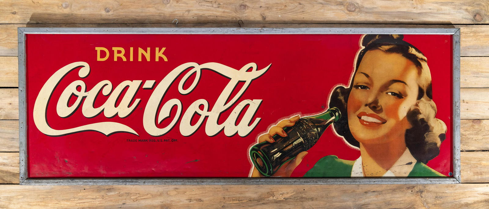 Drink Coca-Cola & Lady Drinking Large SS Metal Sign 8: Large Drink Coca-Cola (Coke) w/ Lady Drinking From A Bottle single sided tin (SST) wood framed sign. Good color and shine. Light wear with fine scratches and dings. Measures 40"x111". Rated 8 by The A