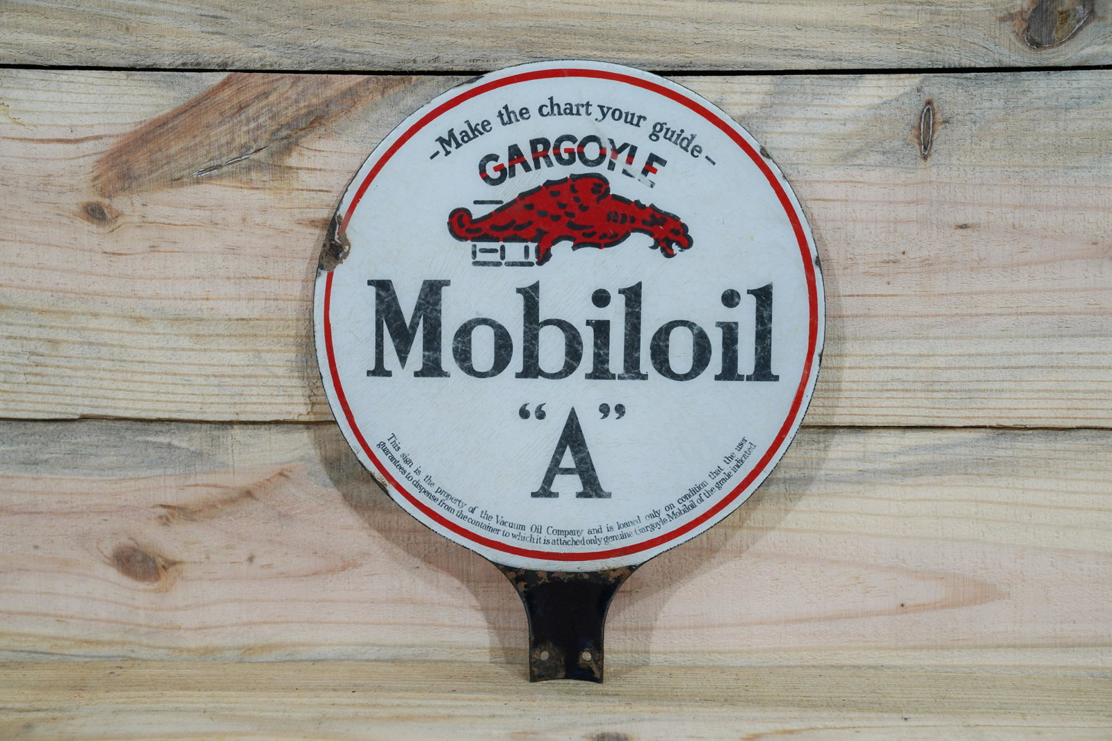 Mobiloil Gargoyle A Lubster Paddle Porcelain Sign 7.5: Mobiloil w/ Gargoyle "A" Double Sided Porcelain (DSP) Lubster Paddle Sign. Good color with light wear and chips around the perimeter. Measures 10.75"x8.75". Rated 7.5 by The Authentication Company (TA