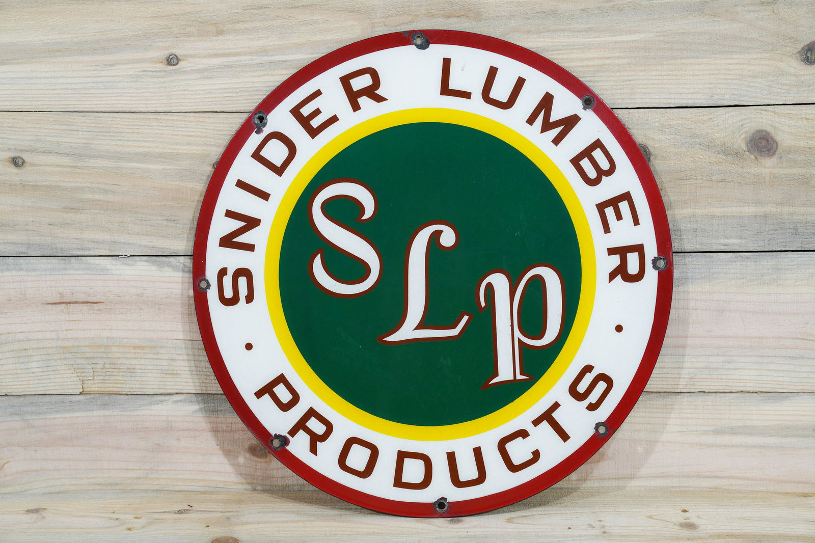 20" Snider Lumber Products Truck Porcelain Sign TAC 8.9: 20" Snider Lumber Products Truck Door Single Sided Porcelain (SSP) Sign. Good color and gloss with chips at the mounting holes. Measures 20"D. Rated 8.9 by The Authentication Company (TAC #038218).