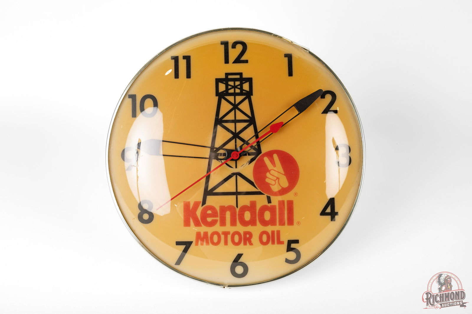 15" Kendall Motor Oil Derreck Logo Lighted Clock TAC 7: 15" Kendall Motor Oil w/ Derreck Logo Lighted Clock TAC 7. The clock lights up and work. The face shows some yellowing. Measures 15" diameter. Condition rated 7 by The Authentication Company.