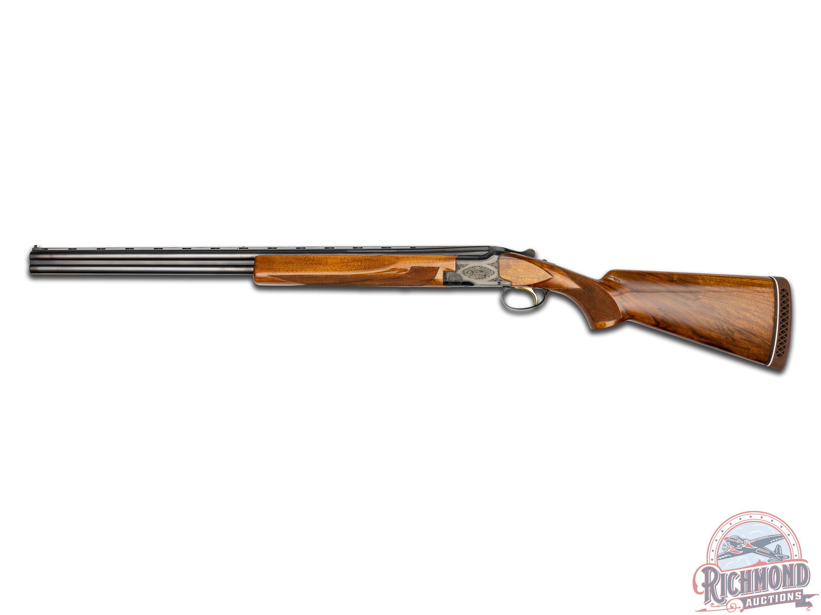 Engraved Belgian Browning Superposed 20 Gauge Skeet Shotgun: Manufactured in 1970 for Browning by FN in Belgium. Blued 26-1/2" over and under special steel barrels with raised ventilated rib, twin beads, fixed skeet and skeet chokes with 2-3/4" chamber and ejec