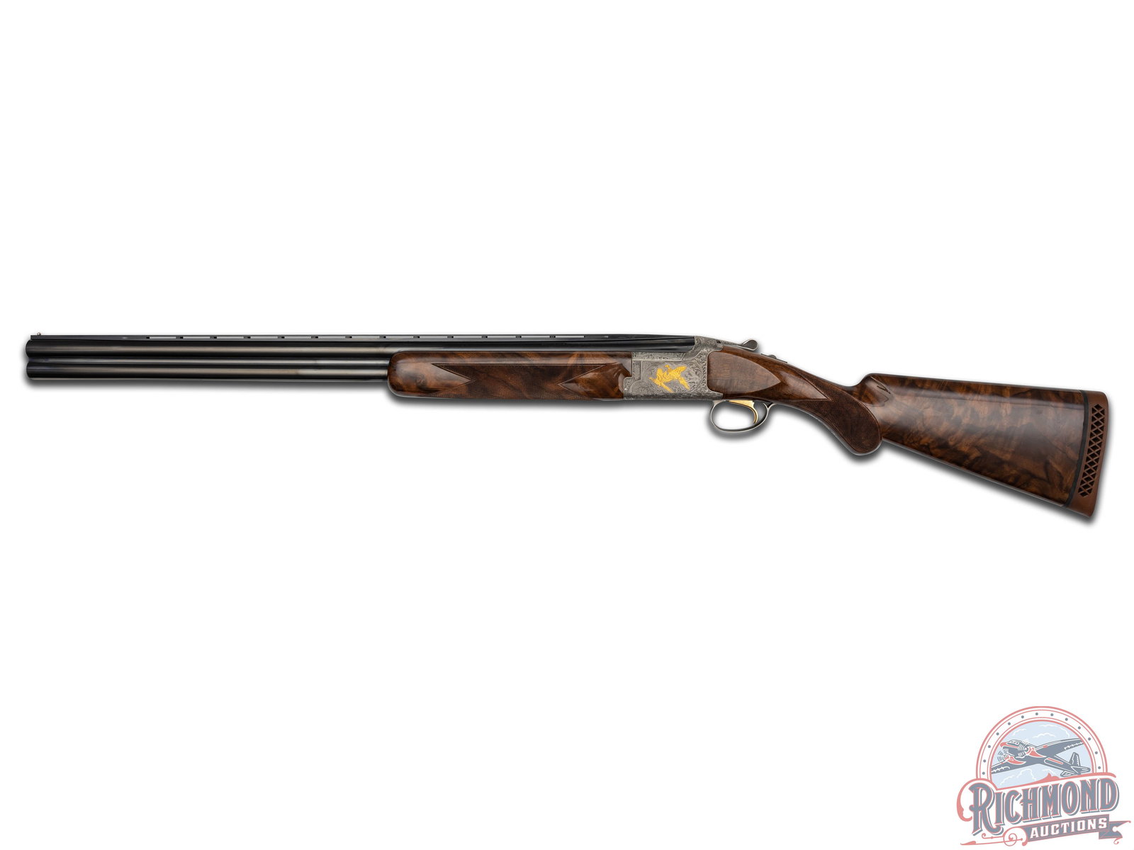Engraved Browning Citori Grade VI Over/Under Shotgun: Manufactured in 1989 in Japan for Browning. Blued 28" O/U steel barrels with ventilated rib, single bead front sight, Invector chokes, and 3" chamber and ejectors. Greyed steel deep relief engraved bo