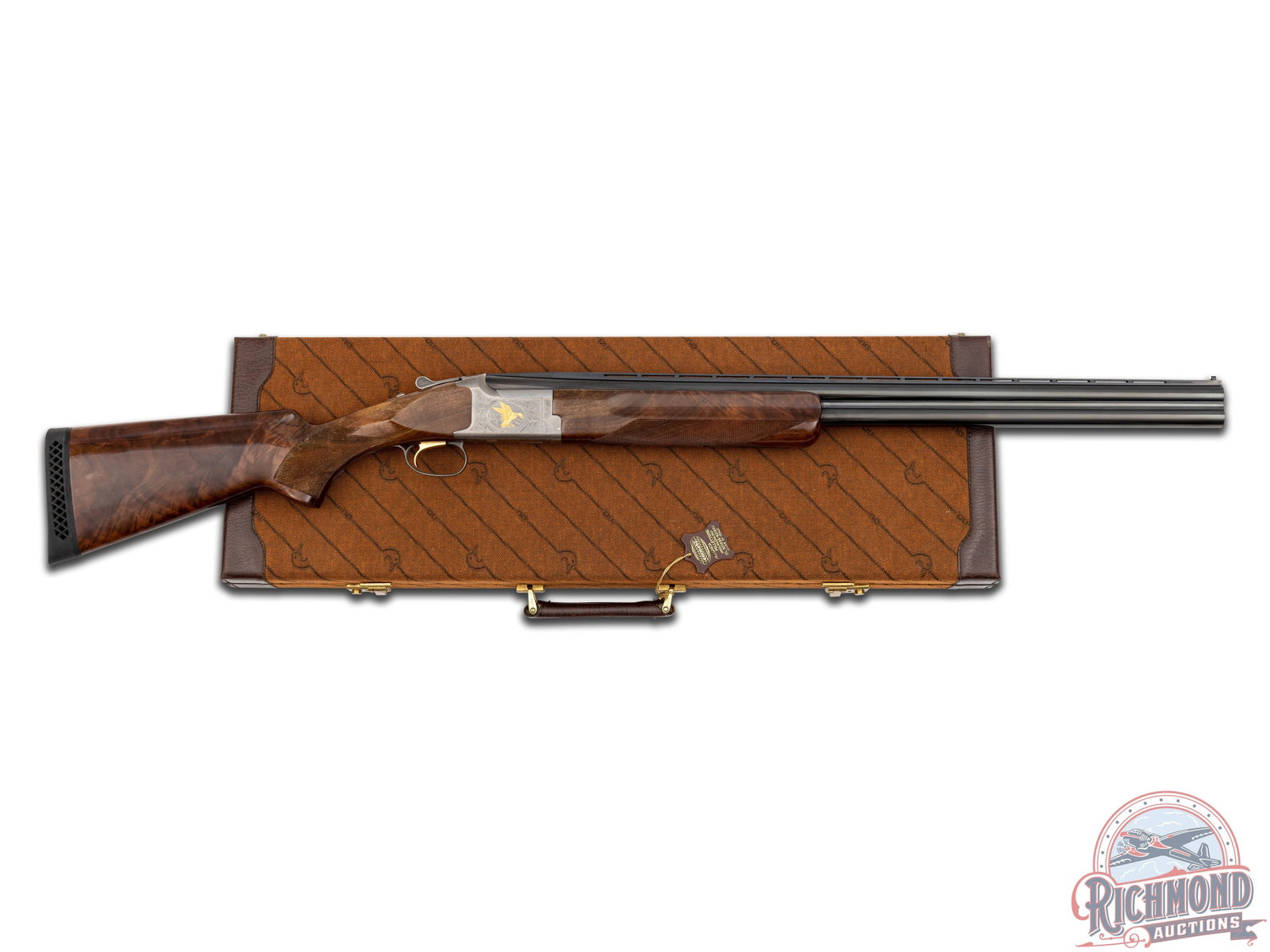 Engraved Browning Citori Ducks Unlimited Over/Under Shotgun & DU Case: Manufactured in 1984 in Japan for Browning. Blued 28" O/U steel barrels with ventilated rib, marked "Ducks Unlimited", and bead front sight, fixed full and modified chokes, and 3" chamber and ejectors