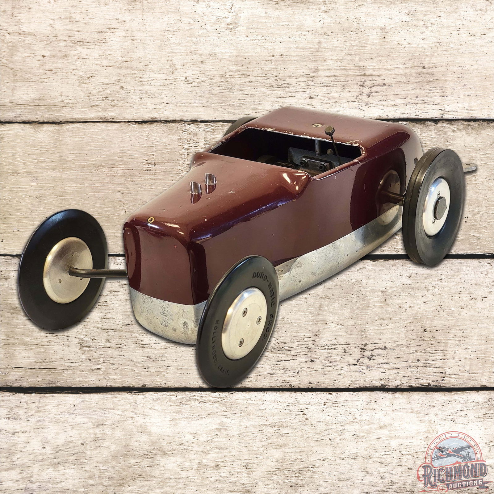 1947 McCoy Hot Rod Tether Car: Produced by Duro-Matic, the Hot Rod was designed by Dick McCoy to resemble a Model A roadster with a '32 Ford grille. This car is wearing old paint which retains its brilliance. It is powered by an ig