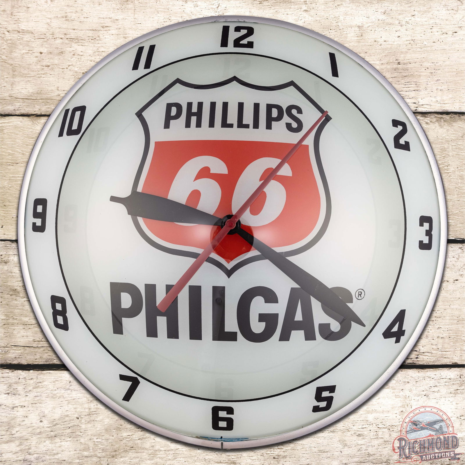 Phillips 66 Philgas 15" Double Bubble Advertising Clock: Exceptional lighted double bubble clock. The clock and light work correctly. The inner and outer face are extremely clean. The can is clean with the factory Advertising Products decal on the reverse.