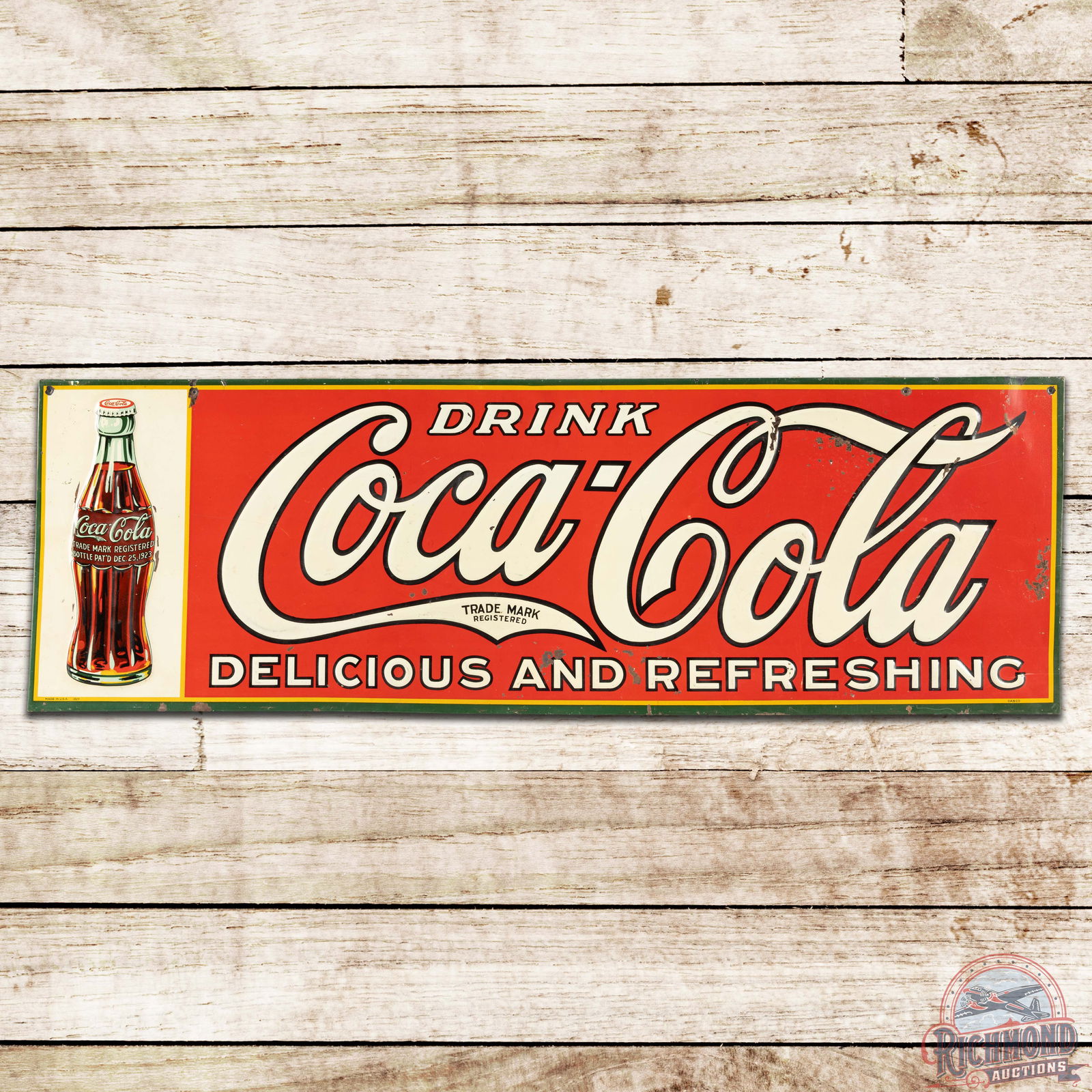 Drink Coca-Cola Delicious and Refreshing SST Sign w/ Christmas Bottle: SST (single sided tin) embossed Coke sign has very good color and shine. The sign features classic Coca-Cola colors with a Christmas bottle. The display has wear with paint chips in the field and oute