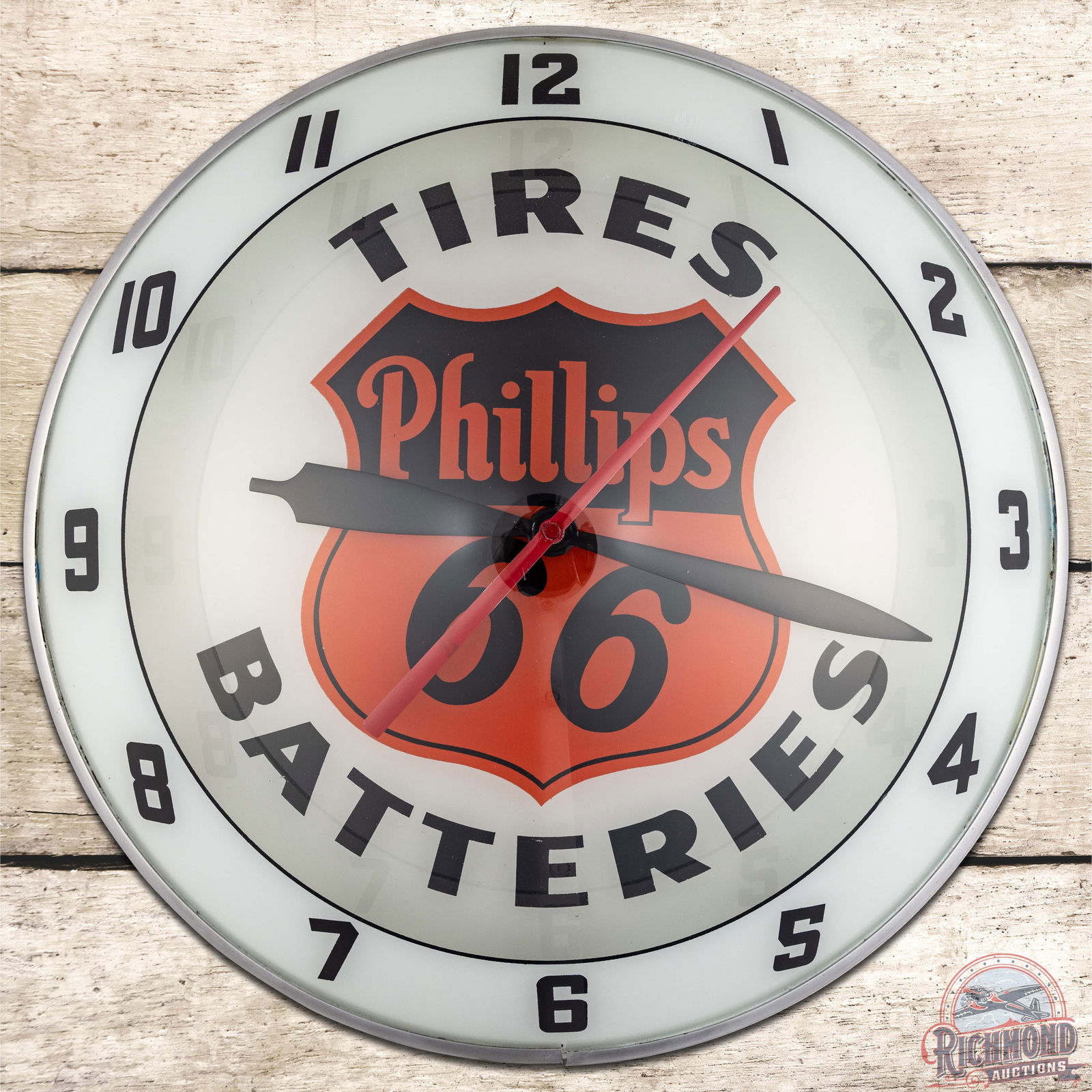 Phillips 66 Tires Batteries 15" Double Bubble Advertising Clock w/ Logo: Fantastic lighted double bubble clock runs and lights up as it should. The inner and outer faces are both very clean. The can has errant paint drips on the reverse and retains the factory Neon Product