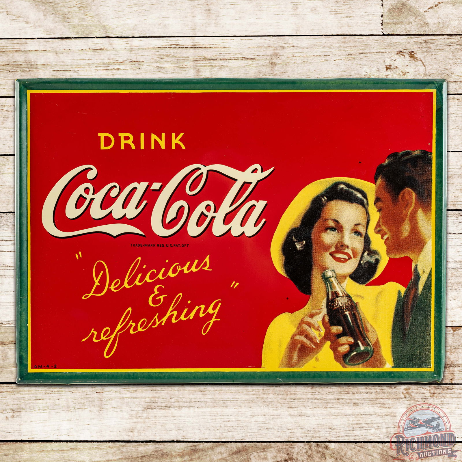 Drink Coca-Cola "Delicious & Refreshing" SST Sign w/ Couple & Bottle: Outstanding SST (single sided tin) self-framed Coke sign has excellent color and shine. It features bold colors with fantastic graphics of a couple with a Coca-Cola bottle. The sign is very clean over