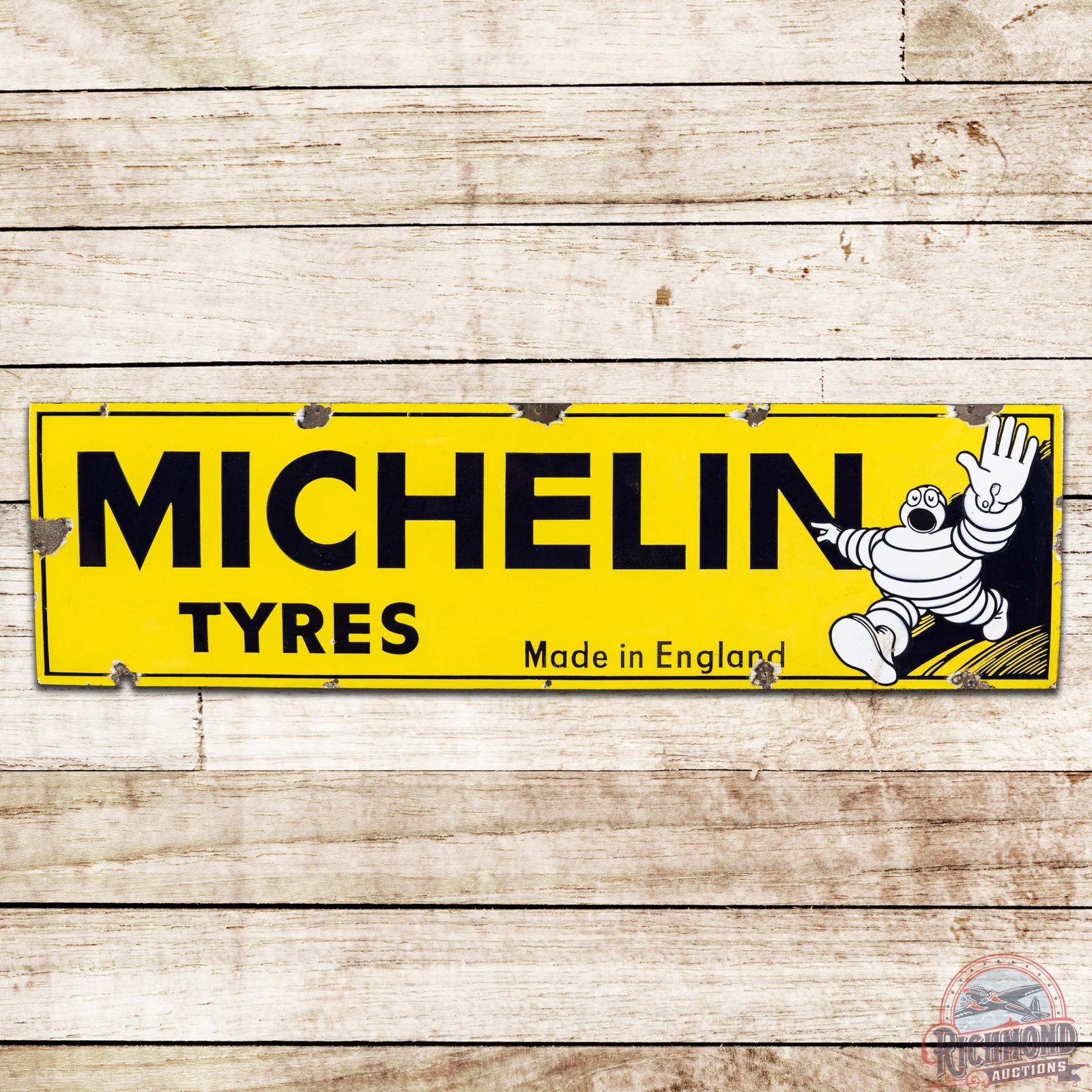 Michelin Tyres SS Porcelain Sign w/ Bibendum: SSP (single sided porcelain) tire sign has very good color and gloss. The field has light wear with small chips and crazing in the lower field. The perimeter has chips at the mount holes with one nail