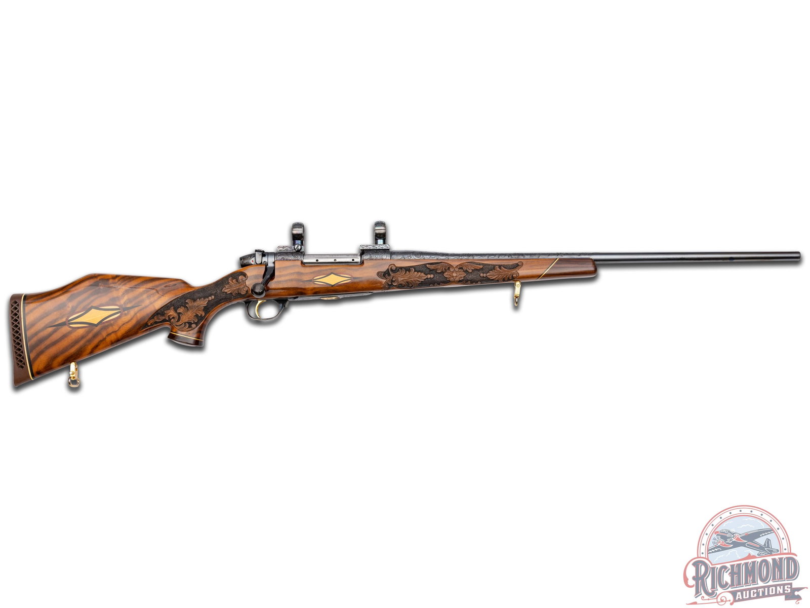 Special Order 1979 Weatherby Mark V Crown Custom Bolt Action Rifle in .300 WBY Mag: Manufactured in 1979. Features a 24.5" blued round sightless tapered barrel. Barrel has 60% coverage featuring floral scroll engraving that extends 12.5" from receiver to end. Receiver has matching en