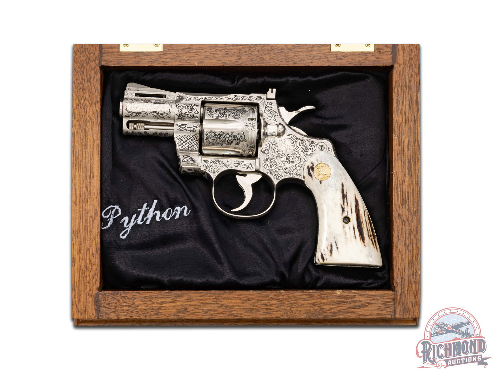 Custom Engraved 1965 Colt Python 2.5" Nickel .357 Magnum Revolver with Case & Archive Letter: Manufactured in 1965. Custom engraved snub nose Python in nickel plated finish with all standard Colt markings. Features a 2.5" ventilated rib barrel with full-length ejector shroud, front ramp sight