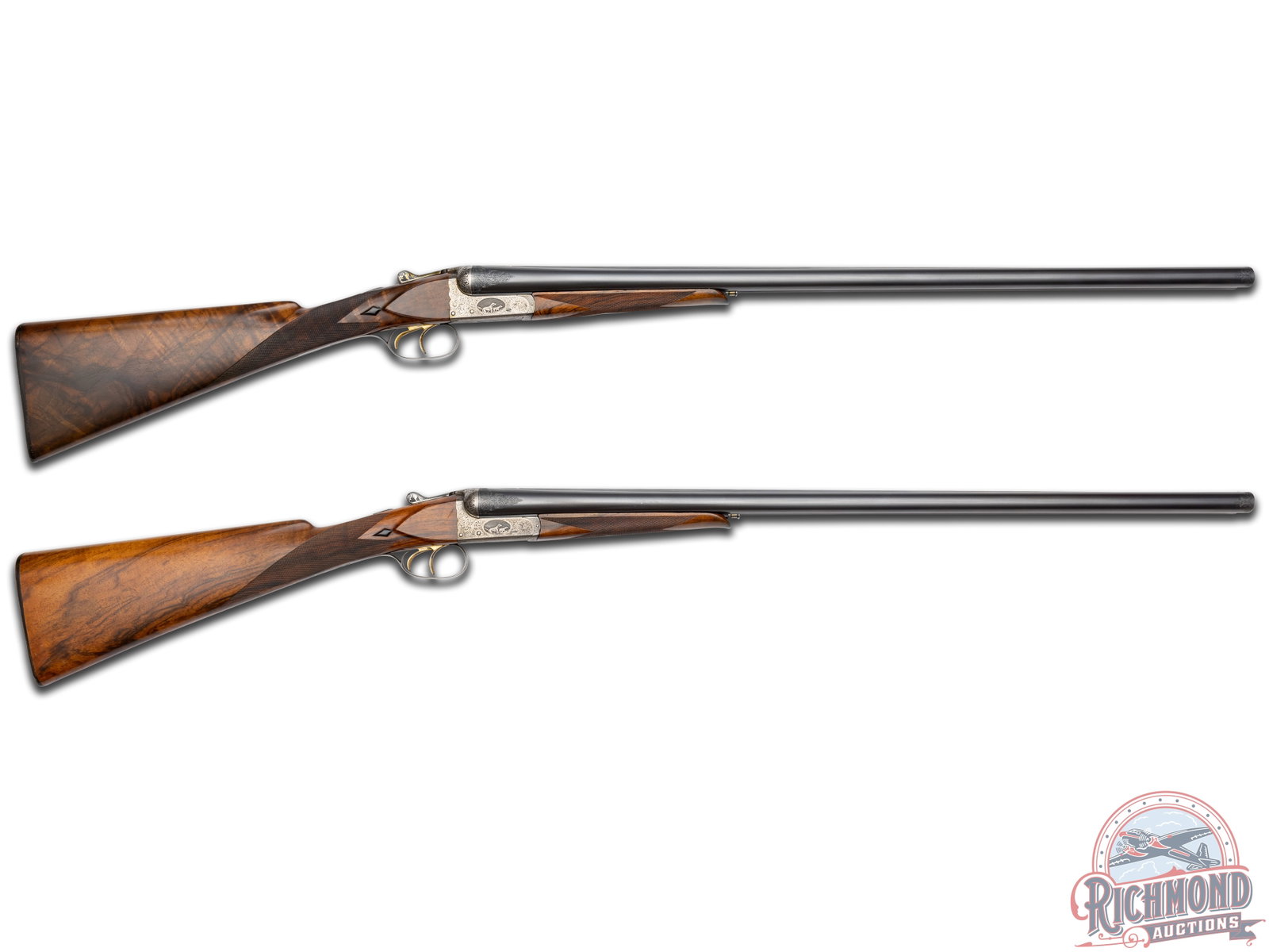 Exceptional Pair of Engraved Webley & Scott 700 Custom Double Barrel 12 Gauge English Shotguns: Gun 1: This stunning shotgun features 30" SxS barrels with full-length raised matted rib and single brass front bead sight. Engraving extends 1.5" at receiver and 0.75" from muzzle. Gold bar inlaid 1.