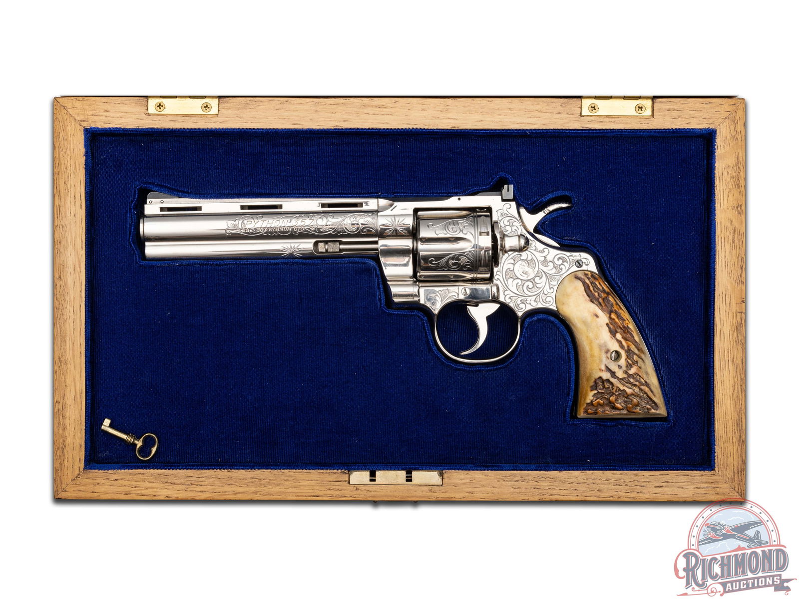 Stunning 1965 Colt Python 6" Nickel Engraved .357 Mag Revolver w/ Stag Grips & Presentation Case: Manufactured in 1965. Built on the "D" frame in a nickel plated finish with all standard Colt markings. Features a 6" ventilated rib barrel with full-length barrel underlug, white highlighted front ra