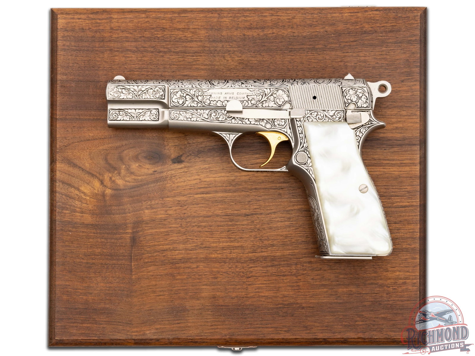 Engraved 1969 Belgian Browning Hi-Power Renaissance 9mm Semi-Automatic Pistol in Presentation Case: Manufactured in Belgium in 1969 with Belgium proof marks. This Hi-Power is calibered in 9mm Luger. Features a 4.75" barrel with half moon front sight and rear windage adjustable notch. Left side of th