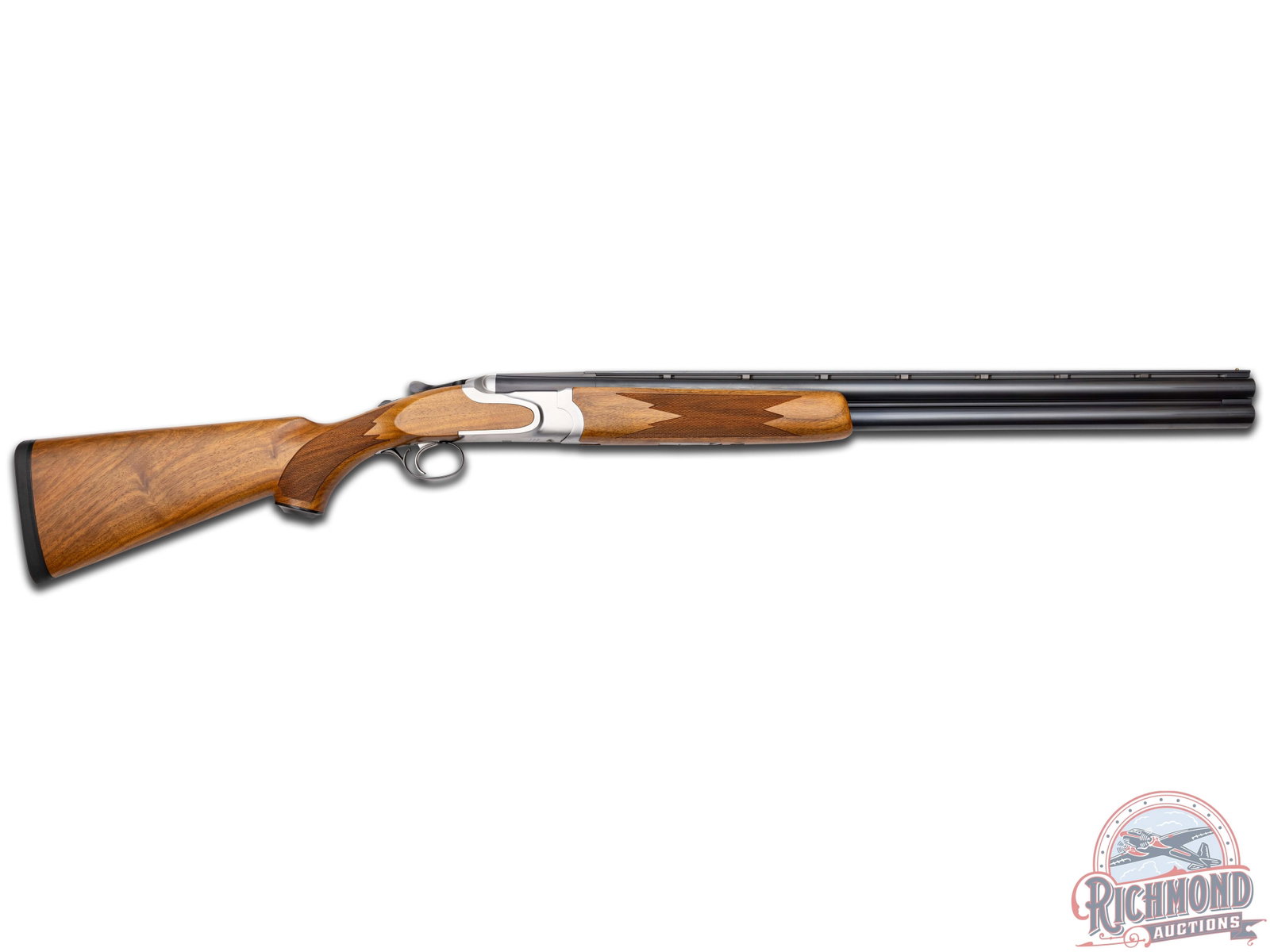 Ruger Red Label Woodside 12 Gauge Over Under Shotgun: Manufactured in 1995. Features 26" blued ventilated rib barrels with brass bead front sight, 3" chambers and screw-in chokes. Stainless steel receiver, stamped on the bottom "Strum, Ruger & Co, Inc/So