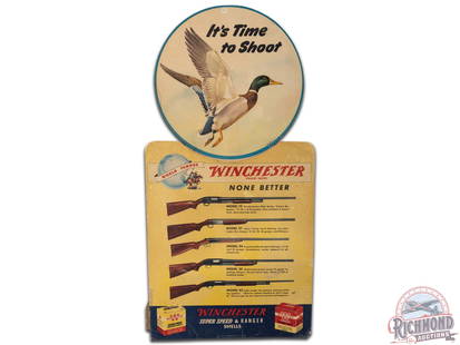 Winchester "It's Time To Shoot" Mallard Cardboard Easel Back Countertop Display Sign: Winchester "It's Time To Shoot" cardboard easel back sign. It has good color and shows some areas of wear, discoloration, loss, pin hole at the top, and a couple creases/cracks in the paper at the bot