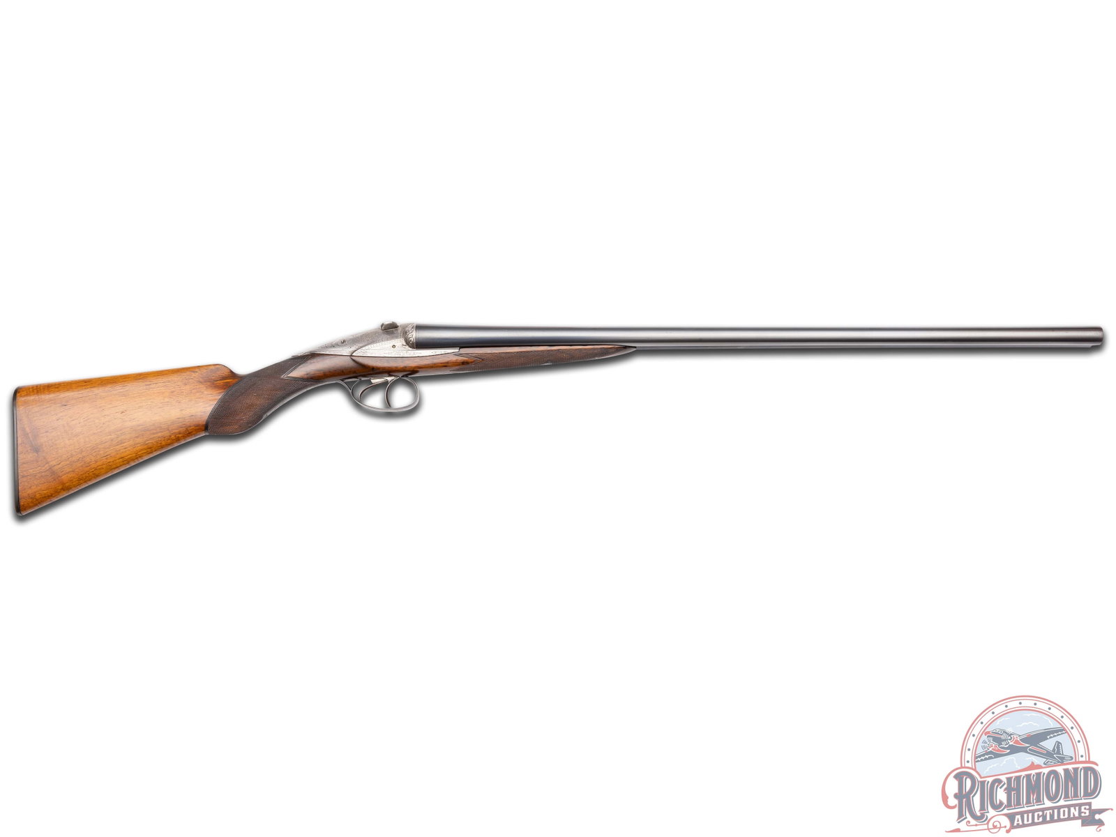 Factory Engraved Darne Sliding Breech 16 Gauge Double Barrel Shotgun: Features 26.75" blued concave rib SxS barrels with single bead front sight. Choked modified and full. Sliding breech action features 60% scroll and floral engraved coverage on coin finish. Blued trigg