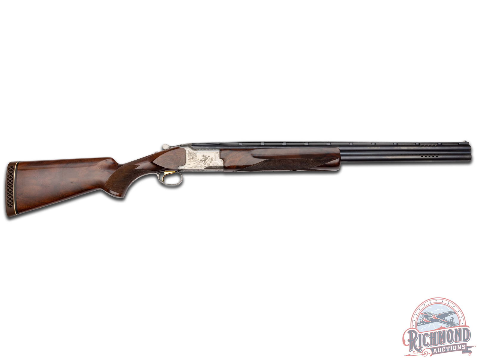 Factory Engraved Browning Citori Grade II Over/Under Skeet Shotgun: Manufactured in 1980. 26" O/U ported barrels with ventilated rib and double bead sights. Skeet and Skeet choke with 2.75" chambers and ejectors. Coin finish receiver with engravings of flying pheasant