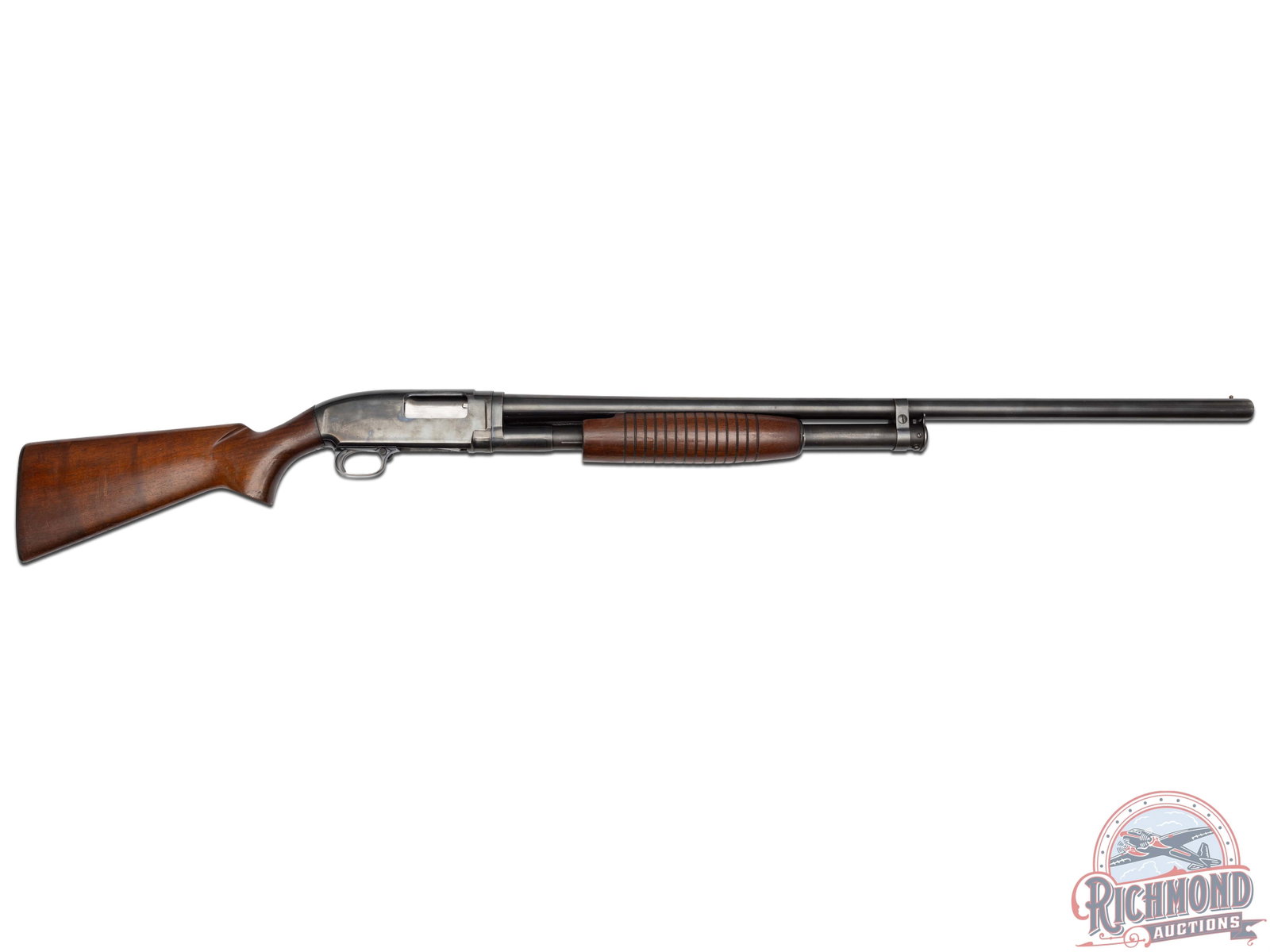 Pre '64 Winchester Model 12 Pump Action 12 Gauge Shotgun 28" Barrel: Manufactured in 1957, this model 12 features a 28" blued barrel chambered for 2-3/4" shells with a Modified choke and brass bead front sight. Blued receiver with notch rear sight with matte top. Cross