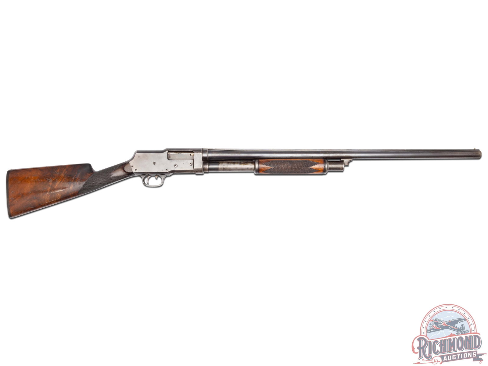 Stevens Model 520 Trap Shooter Grade Pump Action 12 Gauge Shotgun: Manufactured in the early 1920's. Features a 28" blued barrel with solid ventilated rib and brass bead front sight. Chambered for 2-3/4" shells and choked modified. Blued receiver with left side round