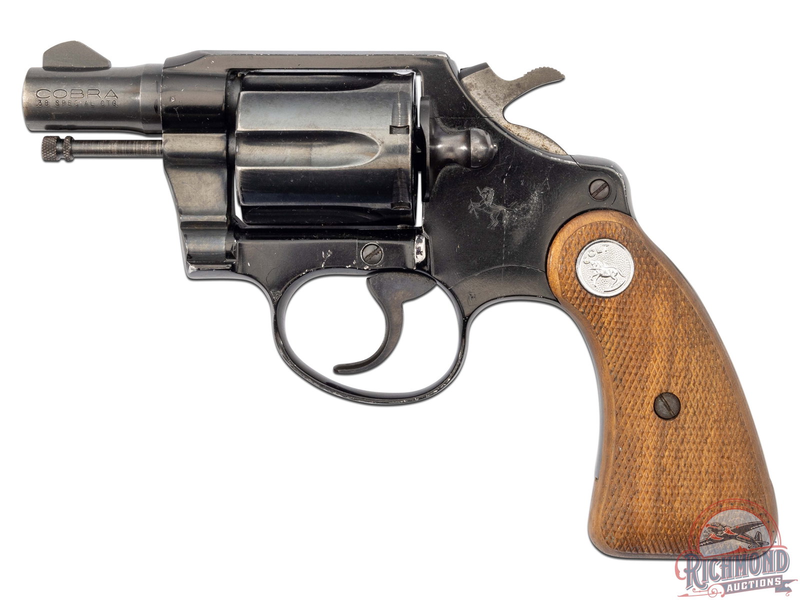 1968 Colt Cobra .38 Special Lightweight SA / DA 2" Snub Nose Revolver: Manufactured in 1968 and denoted with an "LW" behind the serial number. This lightweight snake gun features a 2" blued barrel with blade front sight and integrated notch rear sight. Stamped on the lef