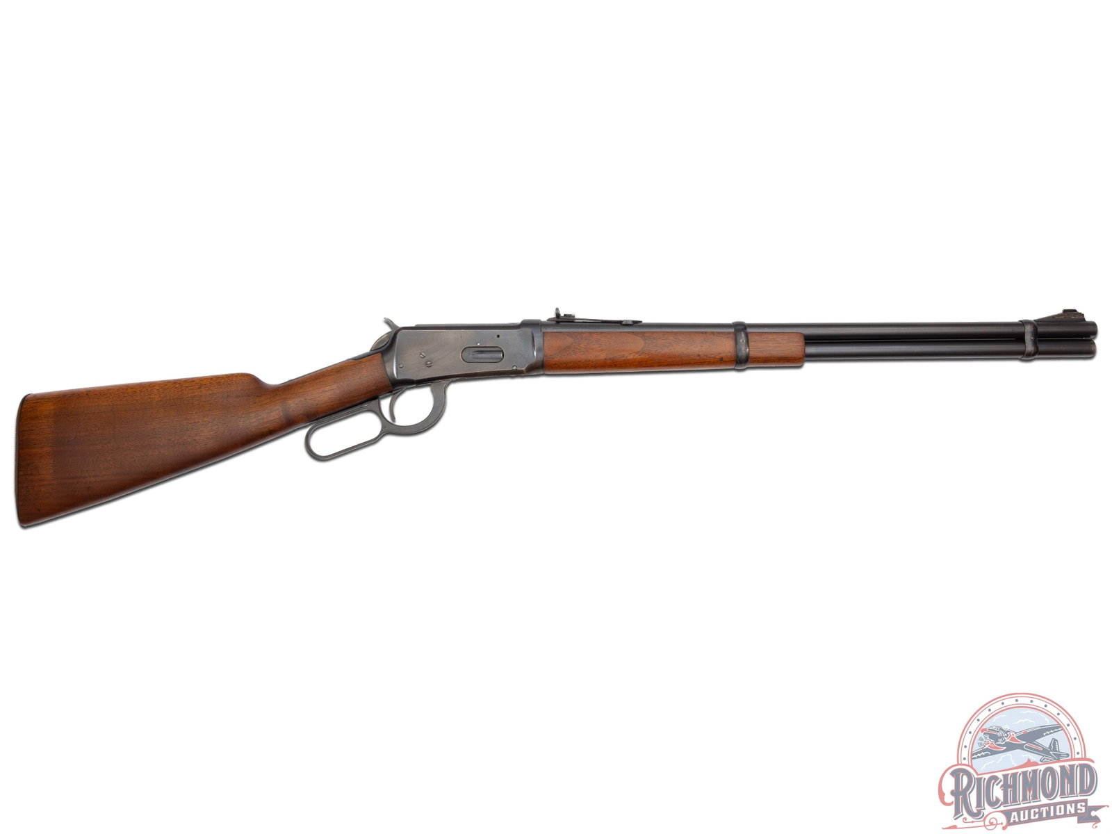 Pre-War Winchester Model 1894 Eastern Lever Action Carbine: Made in 1940. 20" blued round Winchester Proof Steel barrel with standard sights in .32 W.S. caliber. Blued solid frame with full blued tubular magazine. Standard walnut stocks with serrated steel But
