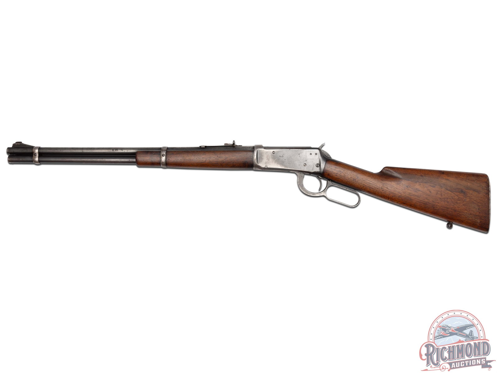 1938 Winchester Model 94 Carbine .30 WCF Lever Action Rifle: Manufactured in 1938, this rifle features a 20" round blued barrel with full length magazine tube, rear buckhorn sight and ramped blade front sight. Left side of the receiver is drilled and tapped rea