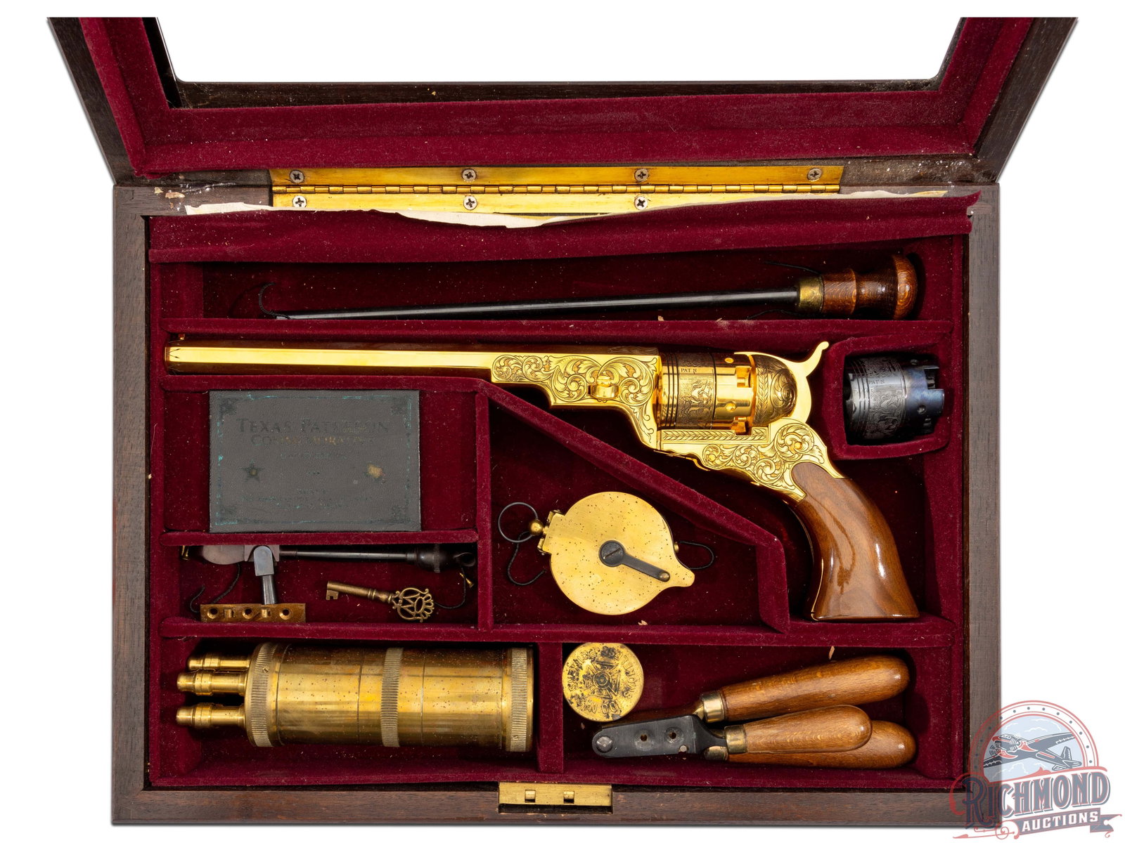 American Historical Patterson 44 Caliber Gold Plated Revolver #138 of 950: Contemporary copy of a Colt Texas Patterson (probably made in Italy). This one being No. 135 of 950. Gun is gold plated and engraved in case with accessories. CALIBER: 0.44. S/N: 138. FFL STATUS: Anti