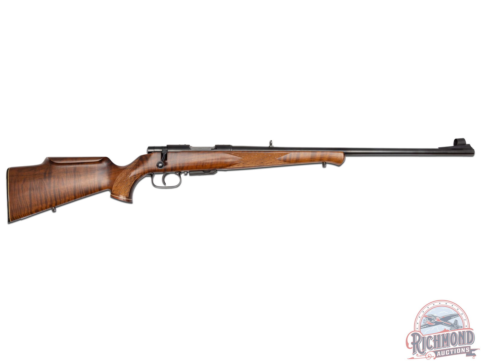 Beautiful Anshutz Model 1740 Meister Grade .222 REM Bolt Action Rifle: Manufactured 1992 in West Germany. Features a 23" blued barrel with flip-up rear adjustable sight with white diamond insert and ramp hooded front post sight. Top of the barrel is stamped "ANSCHUTZ Mod