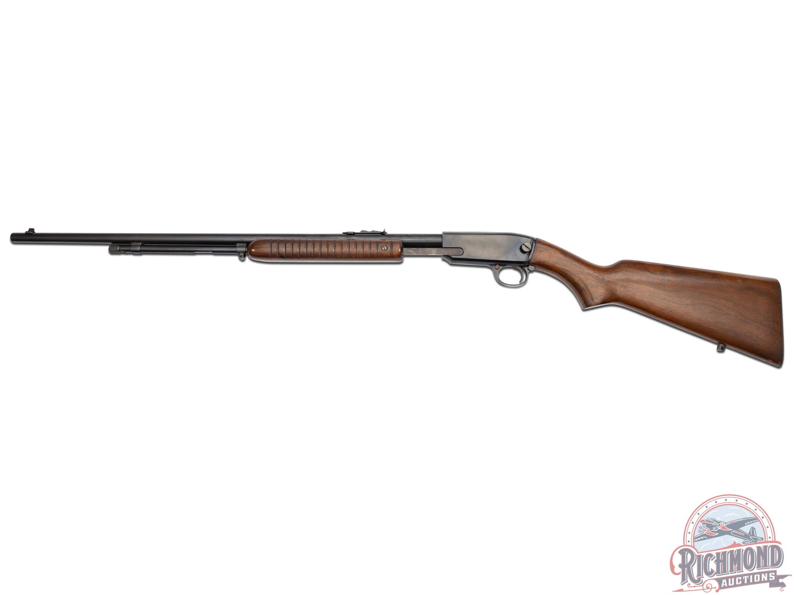 Winchester Model 61 .22 Short / Long / LR Pump Slide Action Rifle: Manufactured in 1957 and features a 24" round blued barrel with blade front sight and rear adjustable notch sight. Tubular magazine. Dovetailed grooved receiver with crossbolt safety. Walnut wood stoc