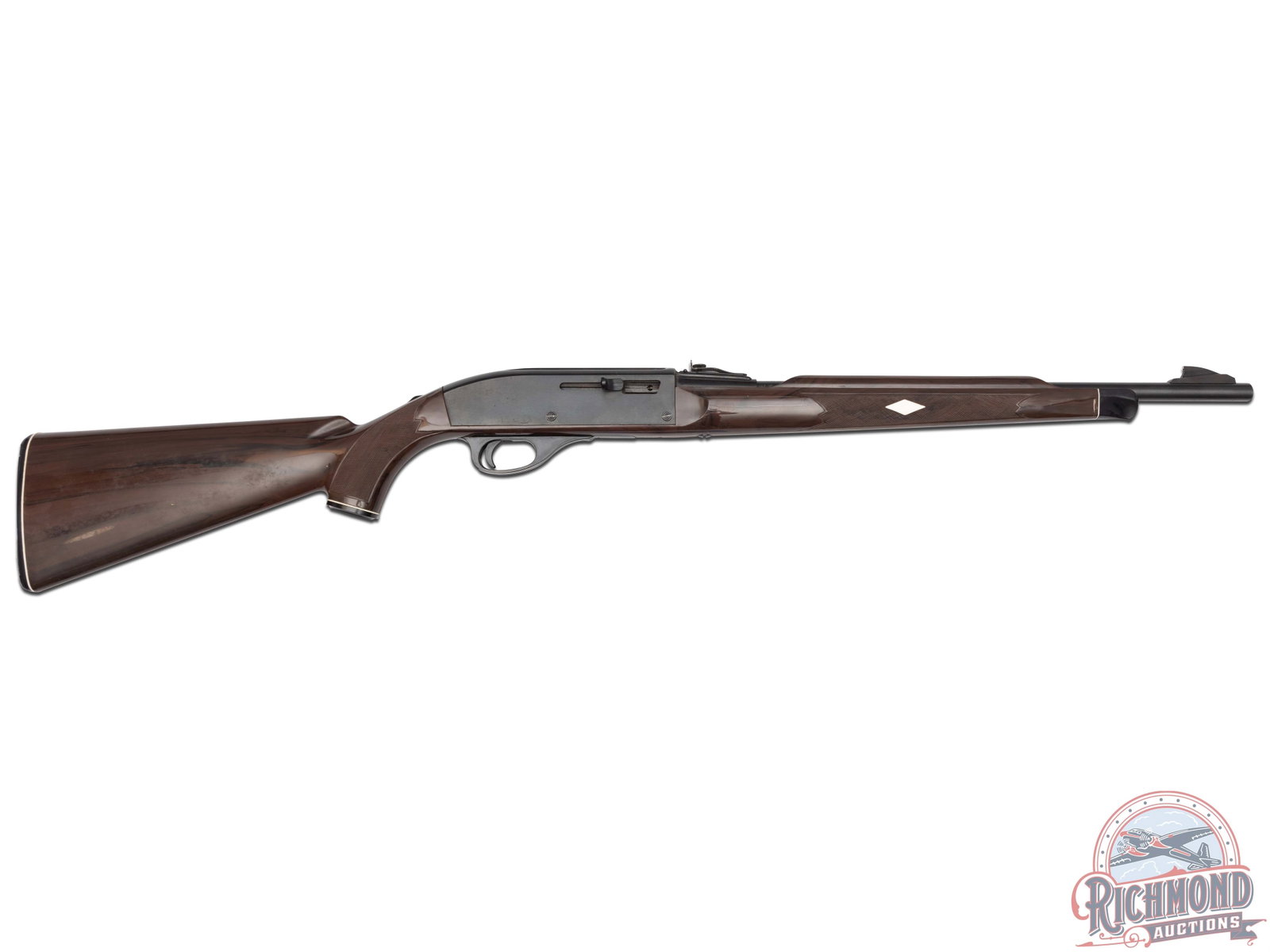 1971 Remington Nylon 66 .22LR Semi-Auto Rifle in Mohawk Brown: Per date code "AU", this Nylon was manufactured in March 1971. Features a 19.5" blued barrel with ramp blade front sight and rear notch with screw adjustment. Top of barrel on the receiver end is stam